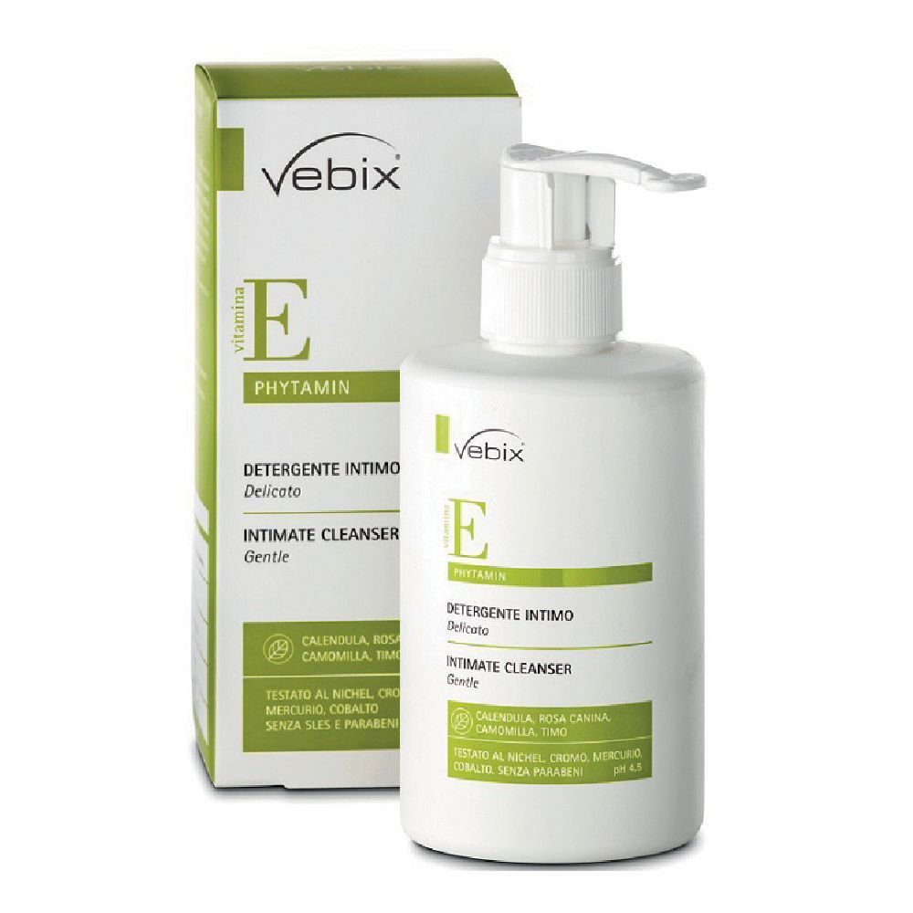 Flacone bianco con dispenser e confezione verde. Scritta: Vebix Phytamin, Intimate Cleanser. Contiene estratti.