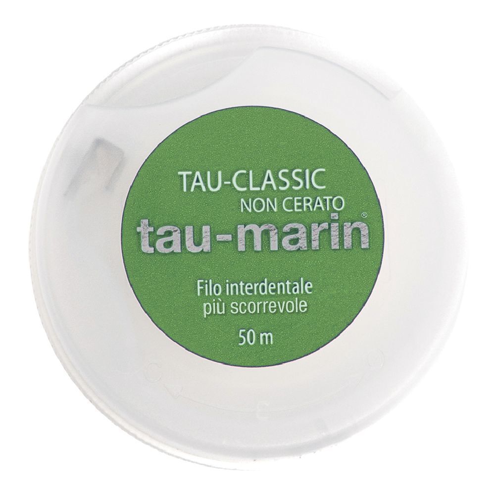 Distributeur de fil dentaire blanc avec étiquette verte. Inscription : Tau-marin, TAU-CLASSIC, Non Cerato.
