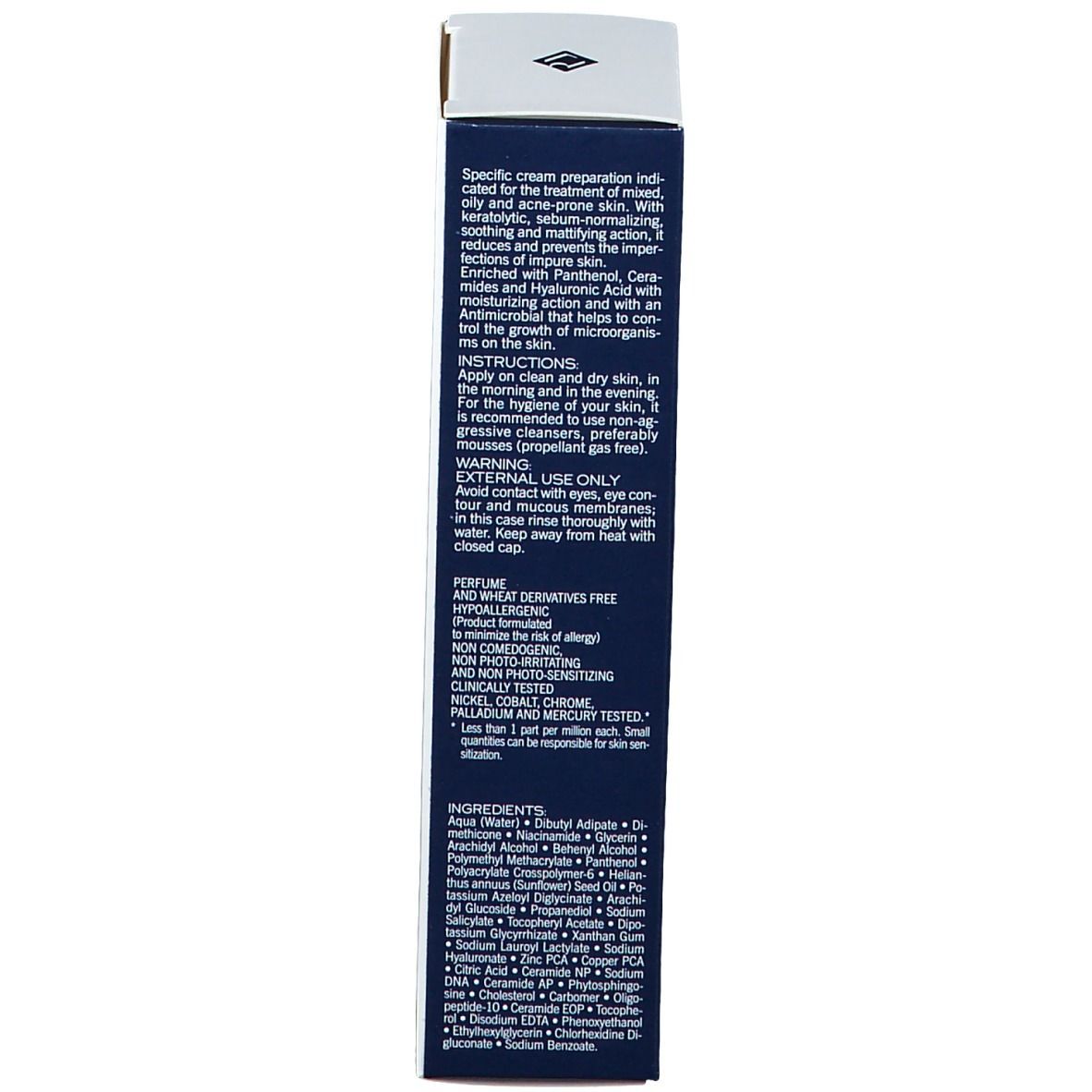 Scatola blu scuro. Testo multilingue. Ingredienti e avvertenze.