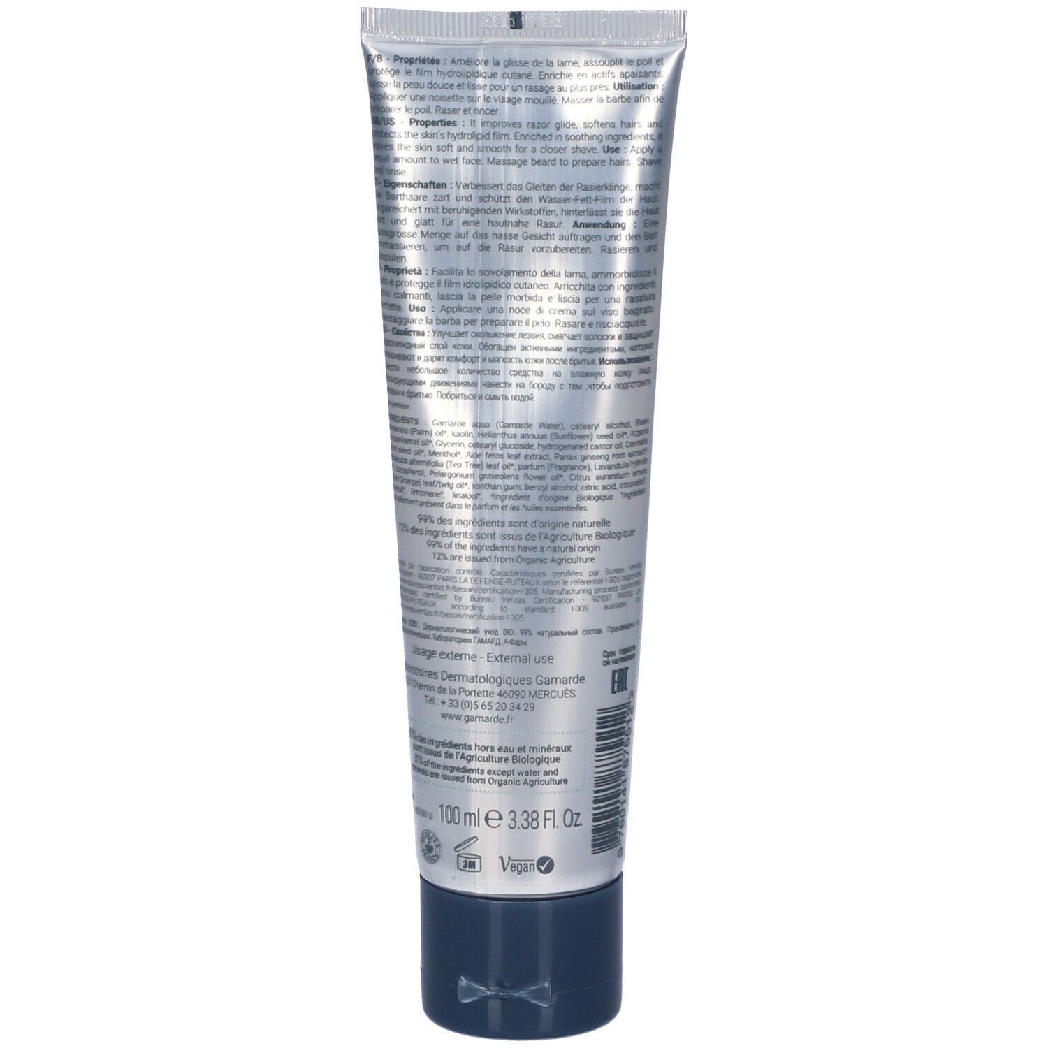 Silberne Tube mit dunklem Verschluss und detaillierten Produktinformationen in mehreren Sprachen.