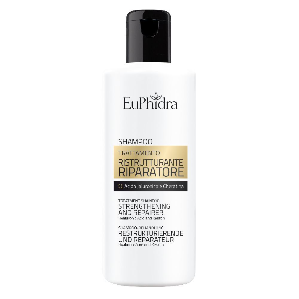 Flacone di shampoo bianco con tappo nero. Scritta: Shampoo, trattamento ristrutturante riparatore.