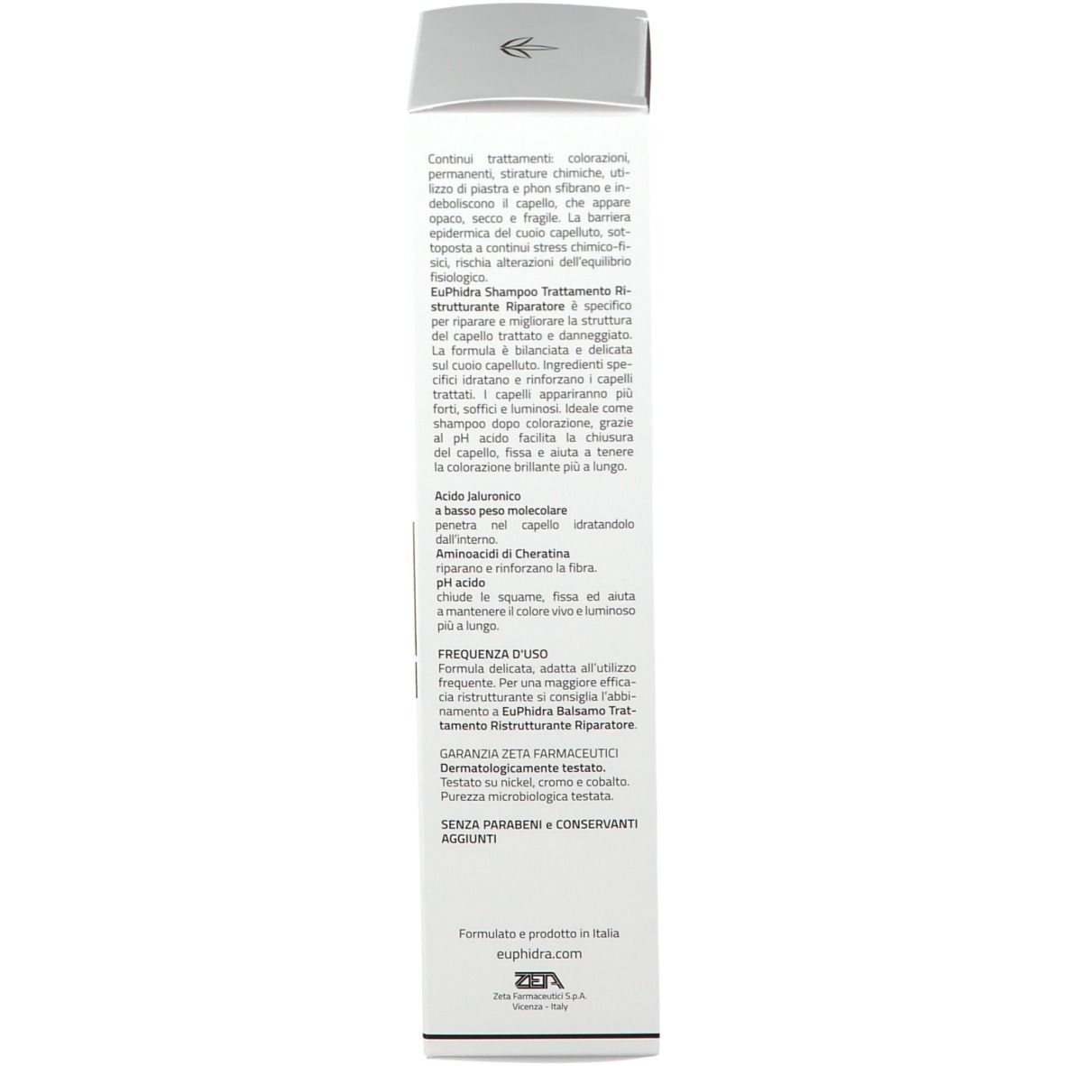 Scatola bianca con testo. Scritta: Shampoo, trattamento ristrutturante riparatore. Testo in italiano.