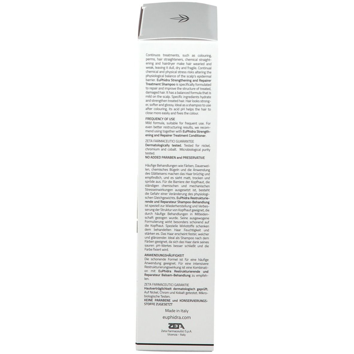 Scatola bianca con testo. Scritta: Shampoo, trattamento ristrutturante riparatore. Testo in inglese.
