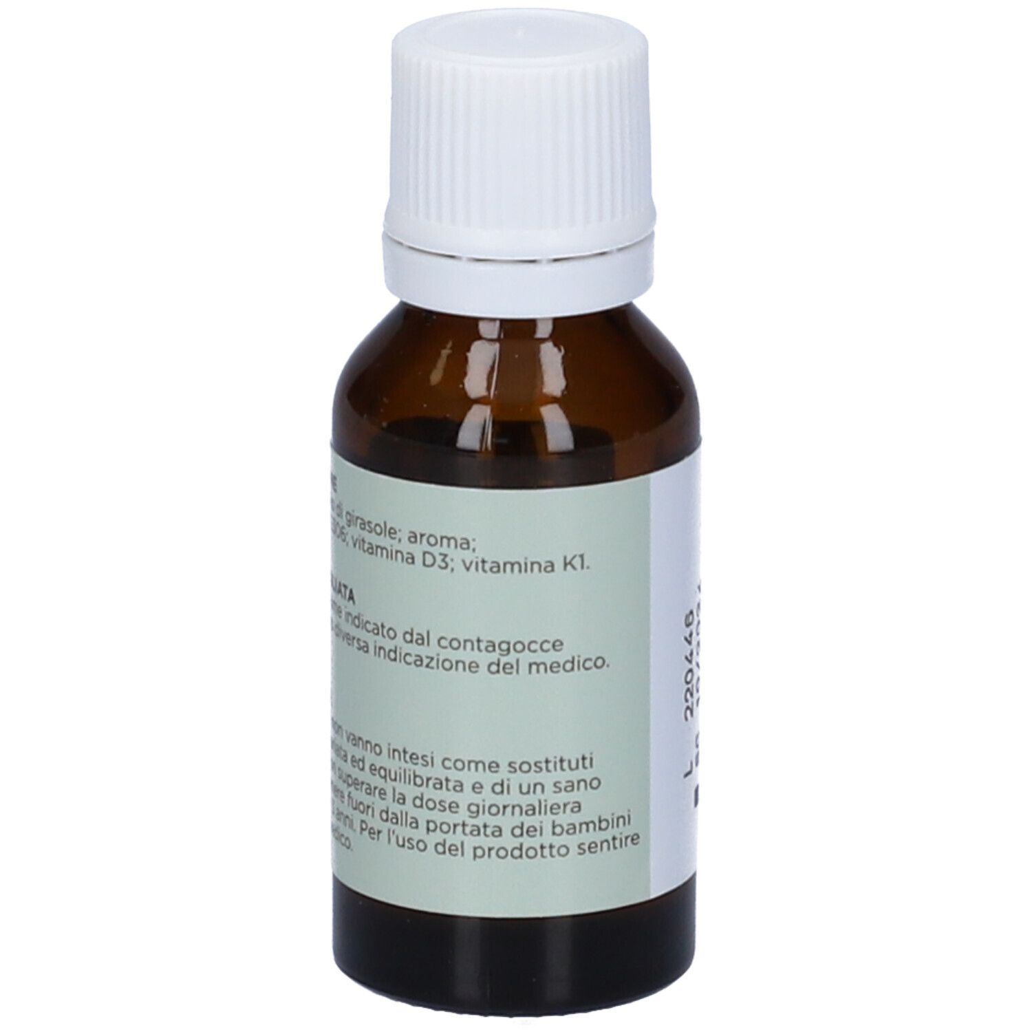 Flacone di vetro marrone con tappo bianco. Scritta: SMART DK, integratore alimentare a base di vitamina D3 e K1. 15 ml. Etichetta.
