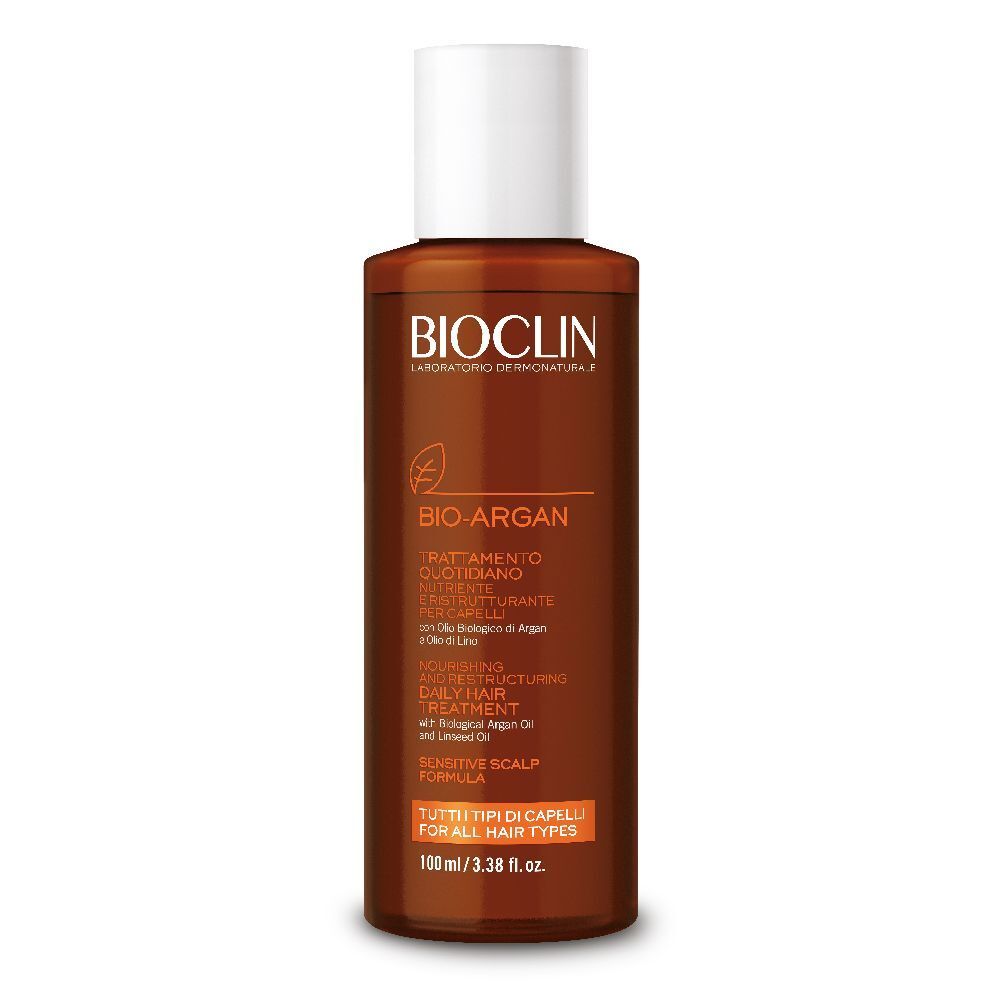 Flacone marrone con tappo bianco. Scritta: BIOCLIN, BIO ARGAN, Trattamento, per tutti i tipi di capelli.