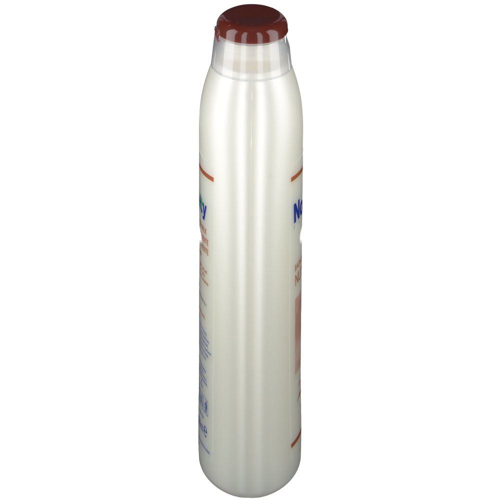 Weißliche Flasche mit braunem Deckel. Seitenansicht. Aufschrift Novelty und Text.
