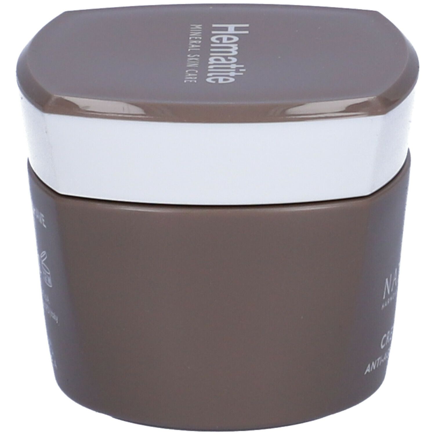 Vaso di crema marrone con coperchio bianco. Scritta: Hämatite.