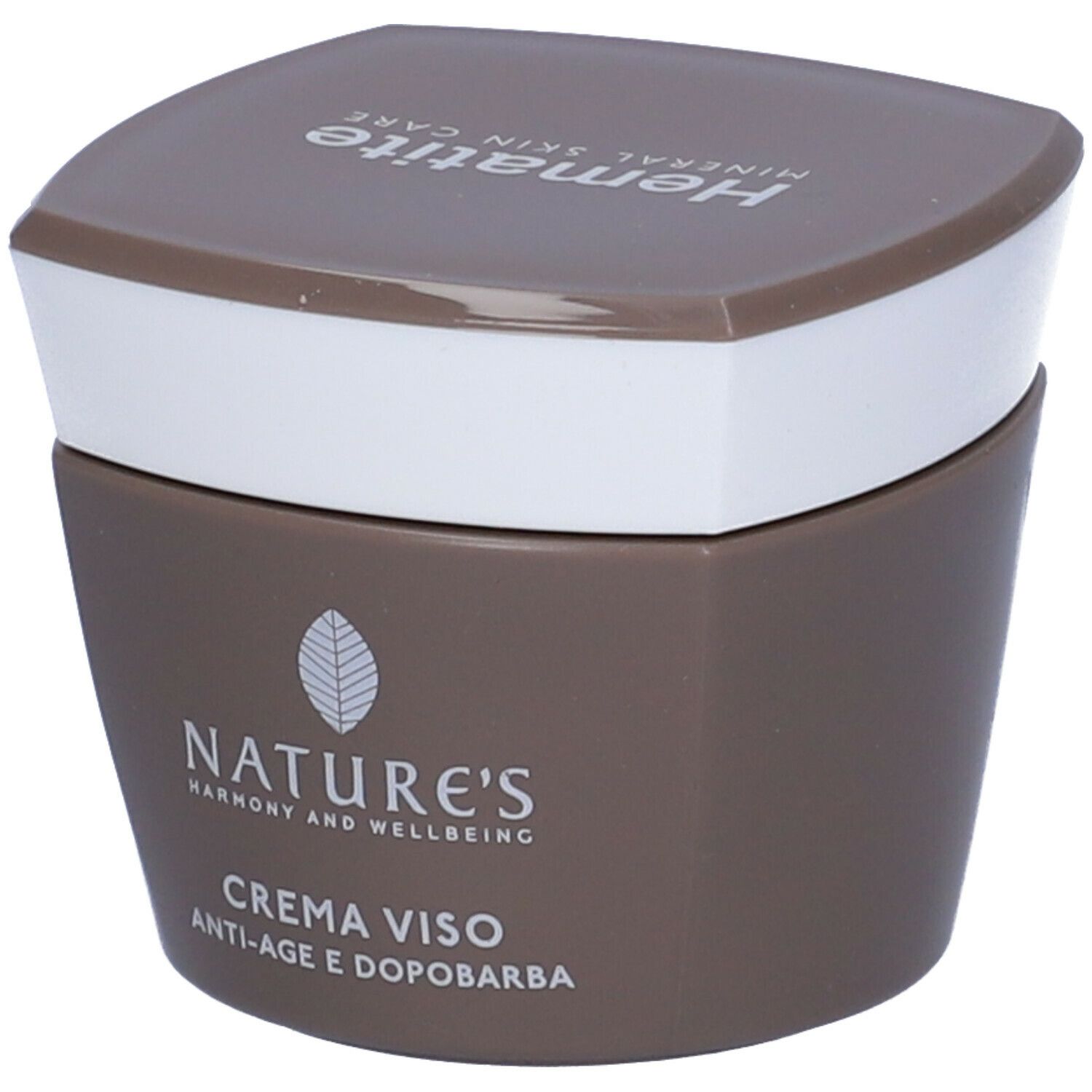 Vaso di crema marrone con coperchio bianco. Scritta: Hämatite, NATURE'S, CREMA VISO, Anti-età e Dopobarba.