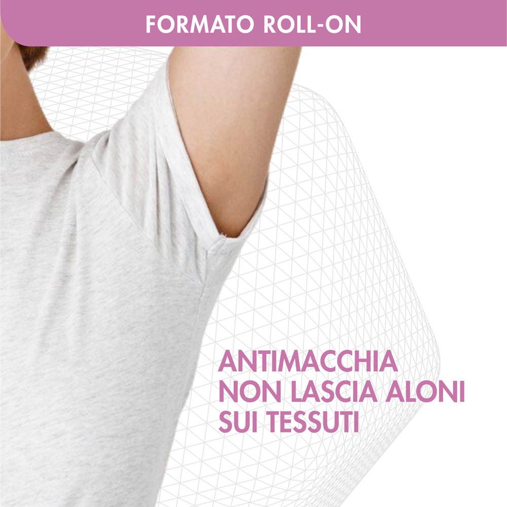 Primo piano di un'ascella con maglietta bianca. Testo: 'FORMATO ROLL-ON', 'ANTIMACCHIA NON LASCIA ALONI SUI TESSUTI'.