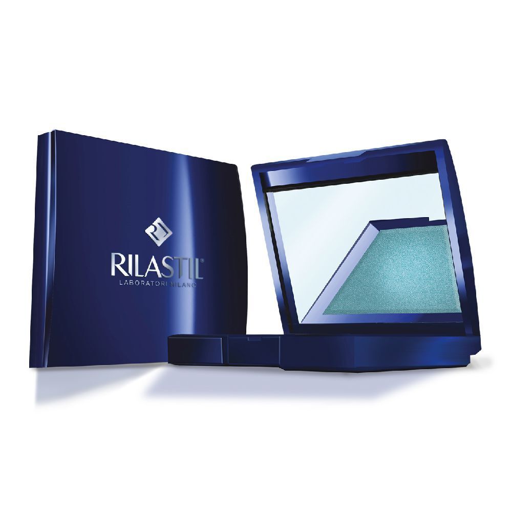 Astuccio cosmetico blu con specchio e ombretto. Marchio Rilastil. Confezione aperta, ombretto turchese. Scritta Rilastil.