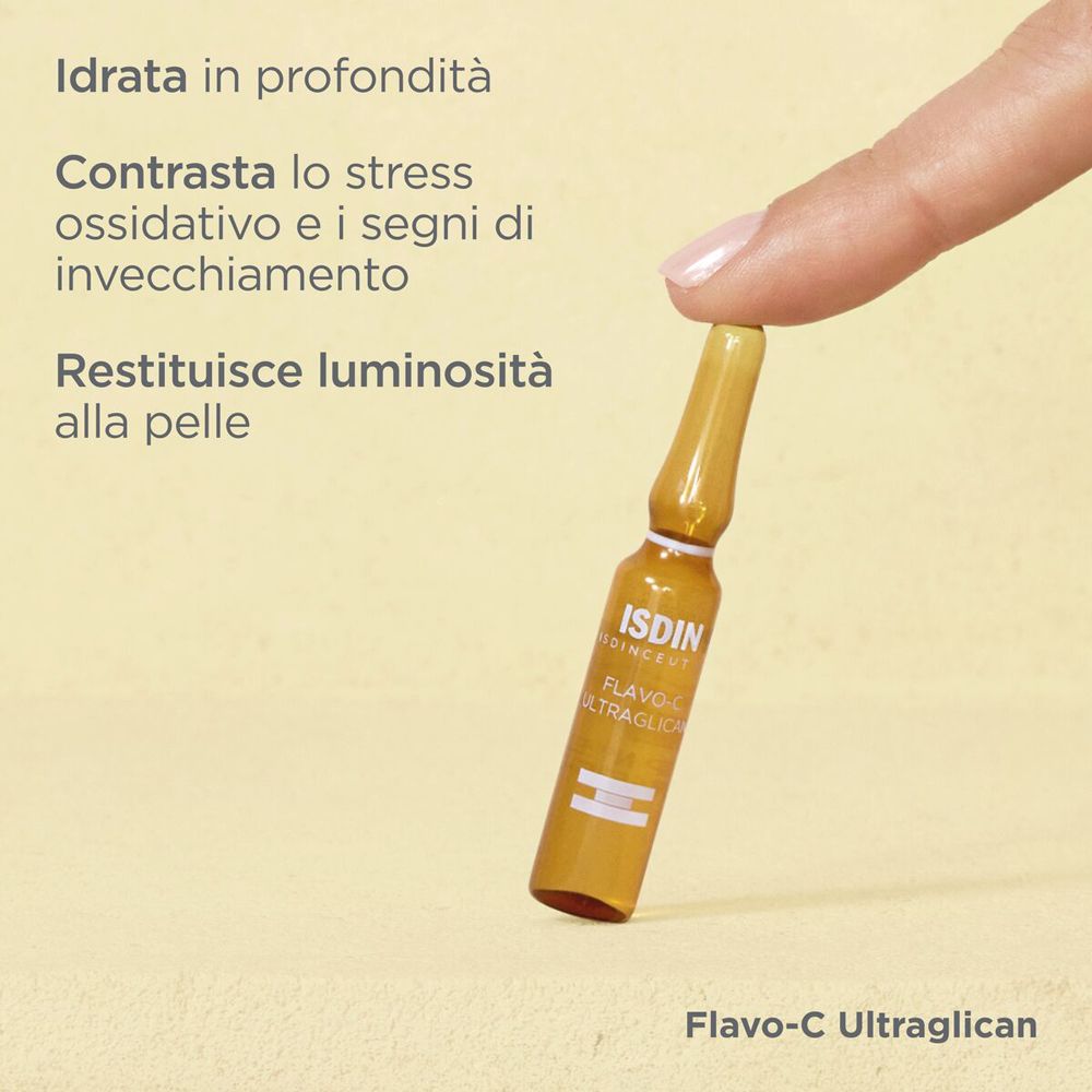 Fiala di ISDIN Isdinceutics Flavoc Ultraglican. Tenuta da una mano. Scritta: ISDIN, Flavoc Ultraglican.