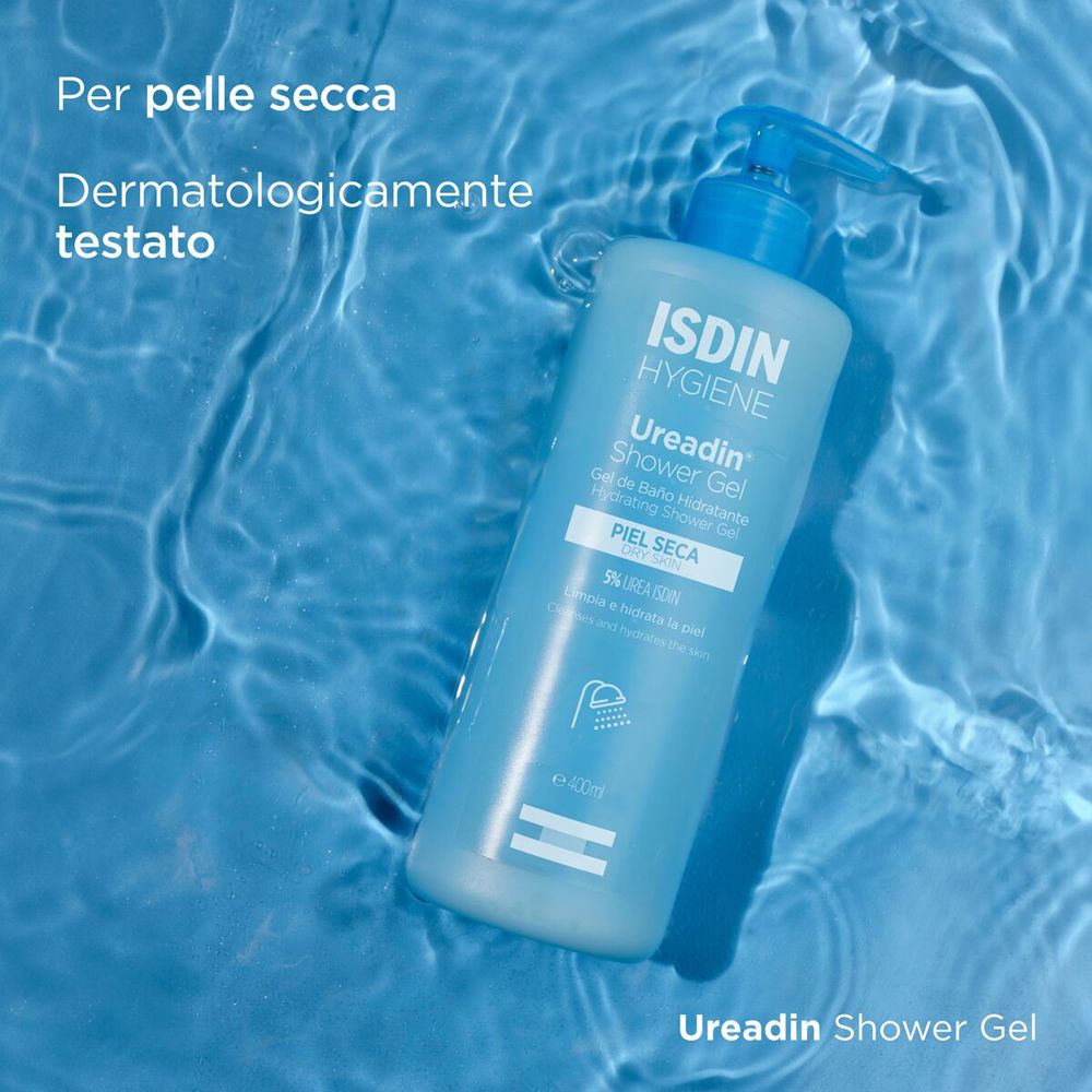 Flacone azzurro nell'acqua. Scritta: ISDIN Hygiene Ureadin Shower Gel. Per pelle secca. Dermatologicamente testato.