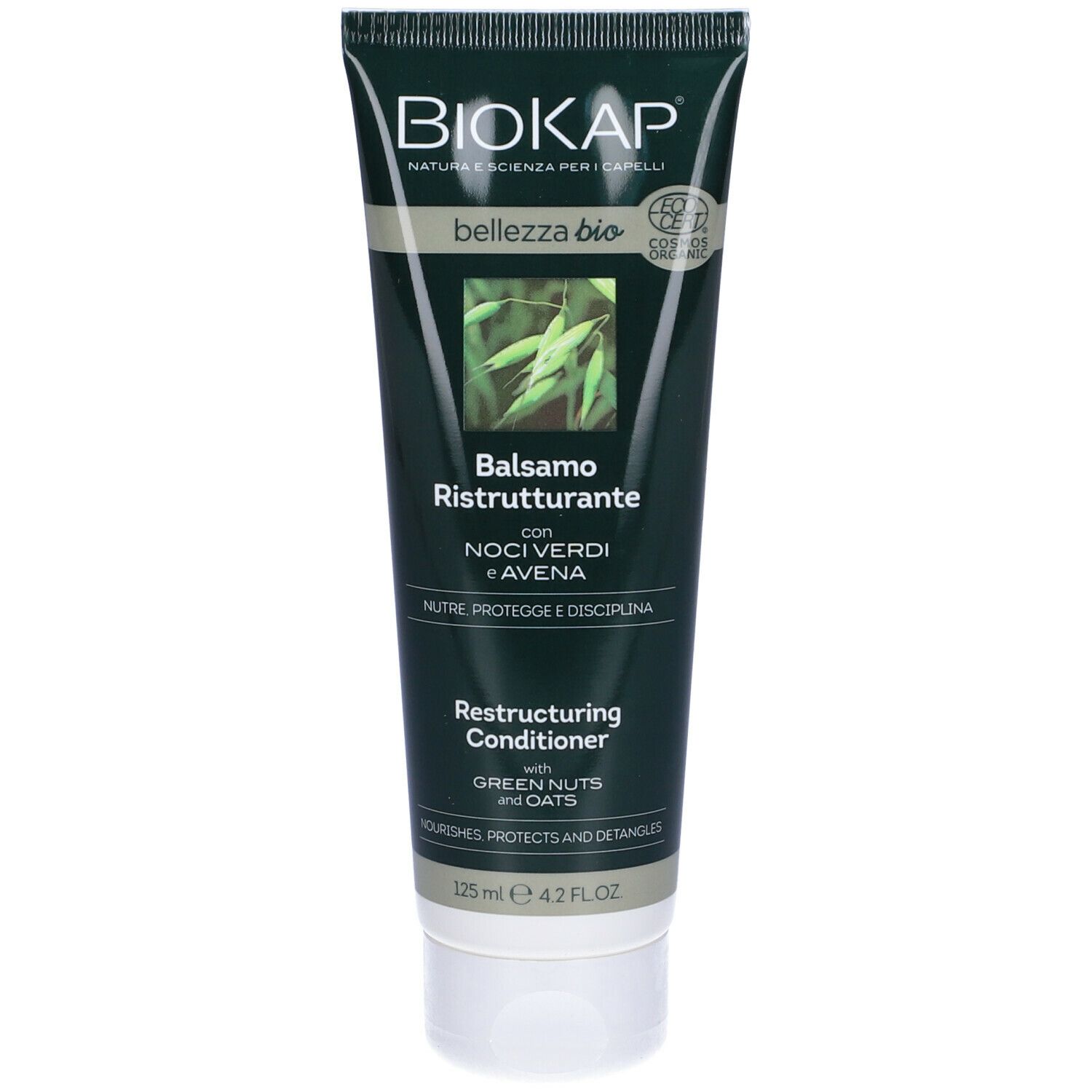 Tubo verde "BIOKAP" con nome prodotto. Balsamo Ristrutturante con Noci Verdi e Avena. Scritta "Restructuring Conditioner". 125 ml.