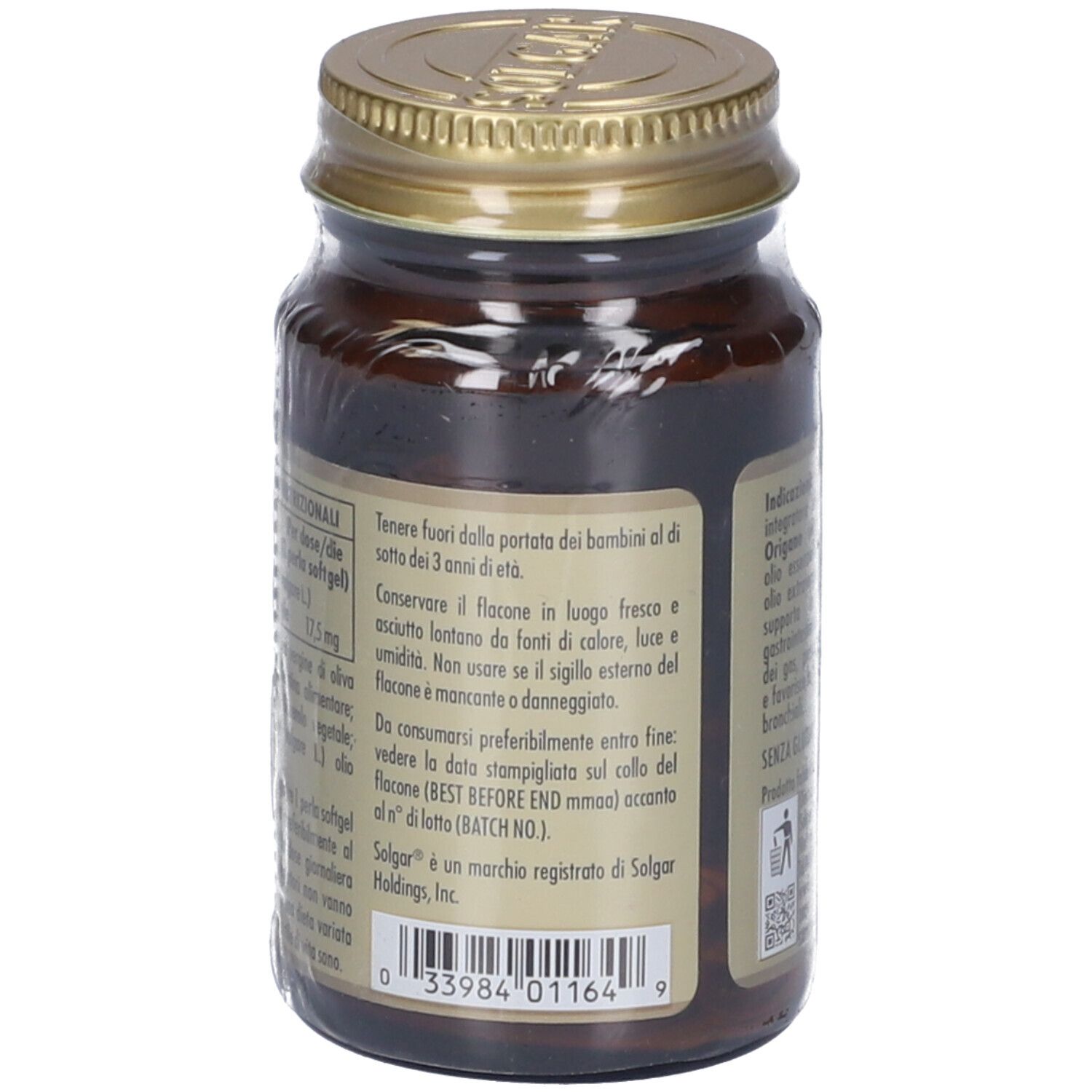 Retro di un flacone di vetro marrone con tappo dorato. Etichetta con testo, tra cui ORIGANOIL, ingredienti e informazioni produttore.