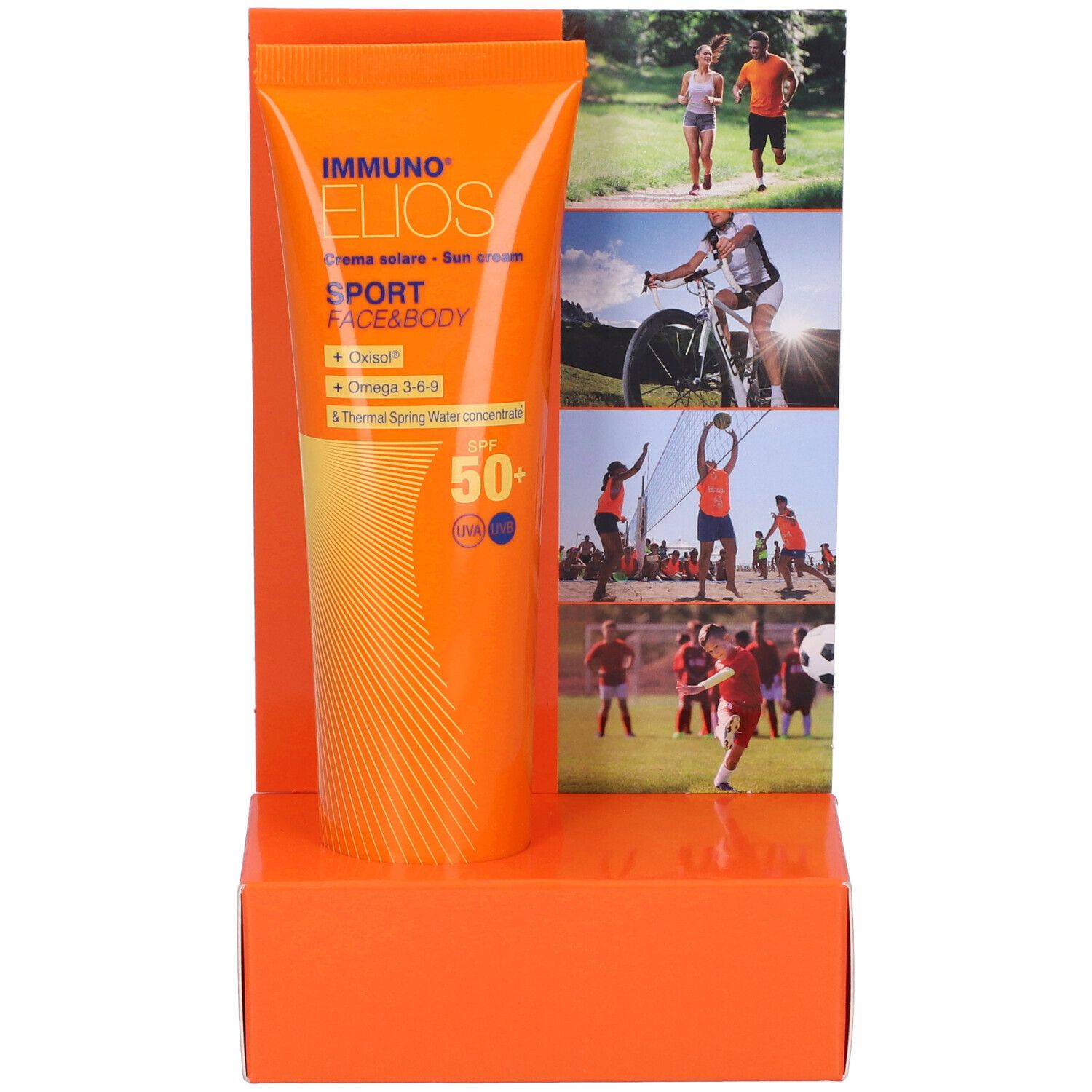 Tubo arancione in esposizione. Scritta: Immuno Elios Sport Face & Body, crema solare, SPF 50+. Sfondo: sportivi.