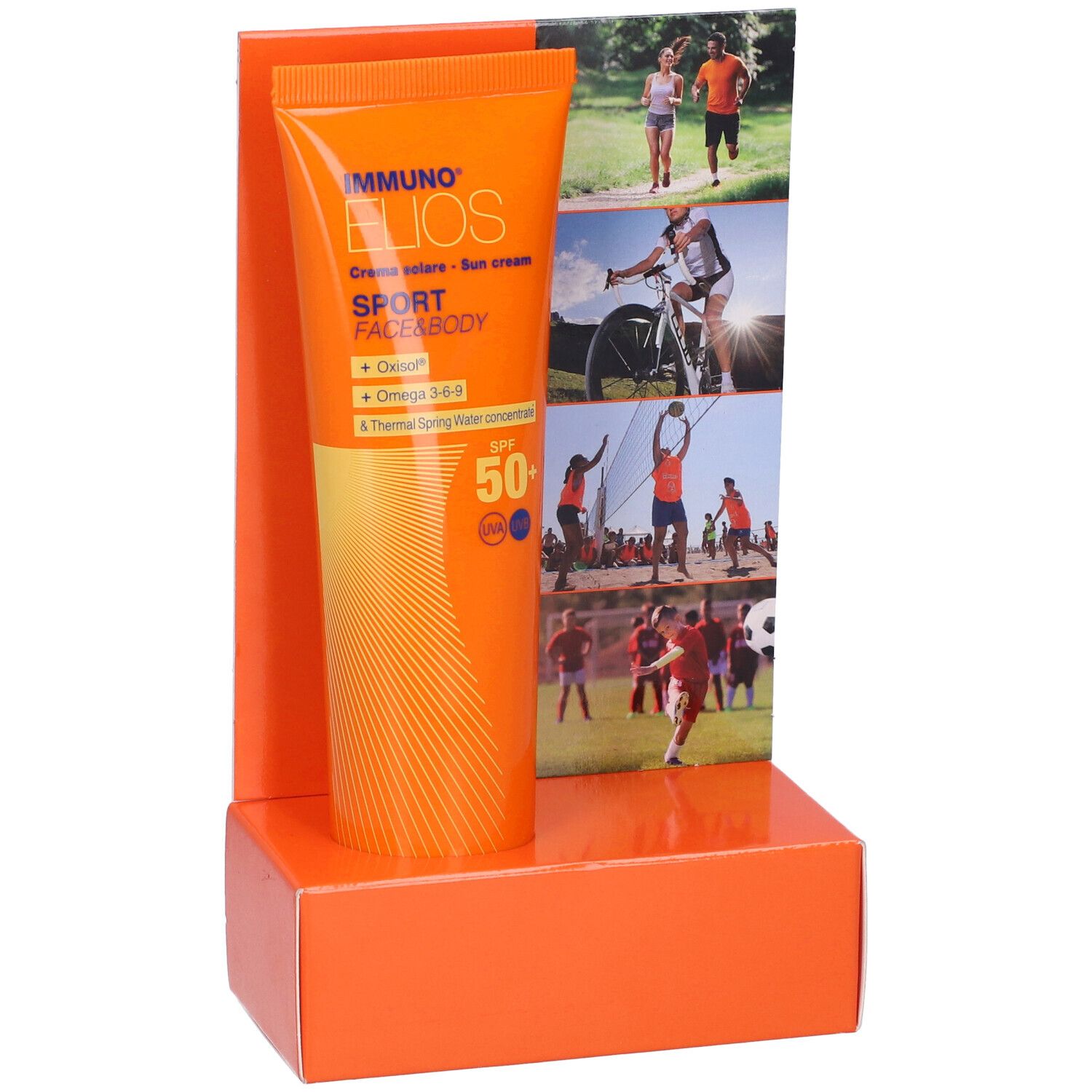 Tubo arancione in esposizione. Scritta: Immuno Elios Sport Face & Body, crema solare, SPF 50+. Sfondo: sportivi.