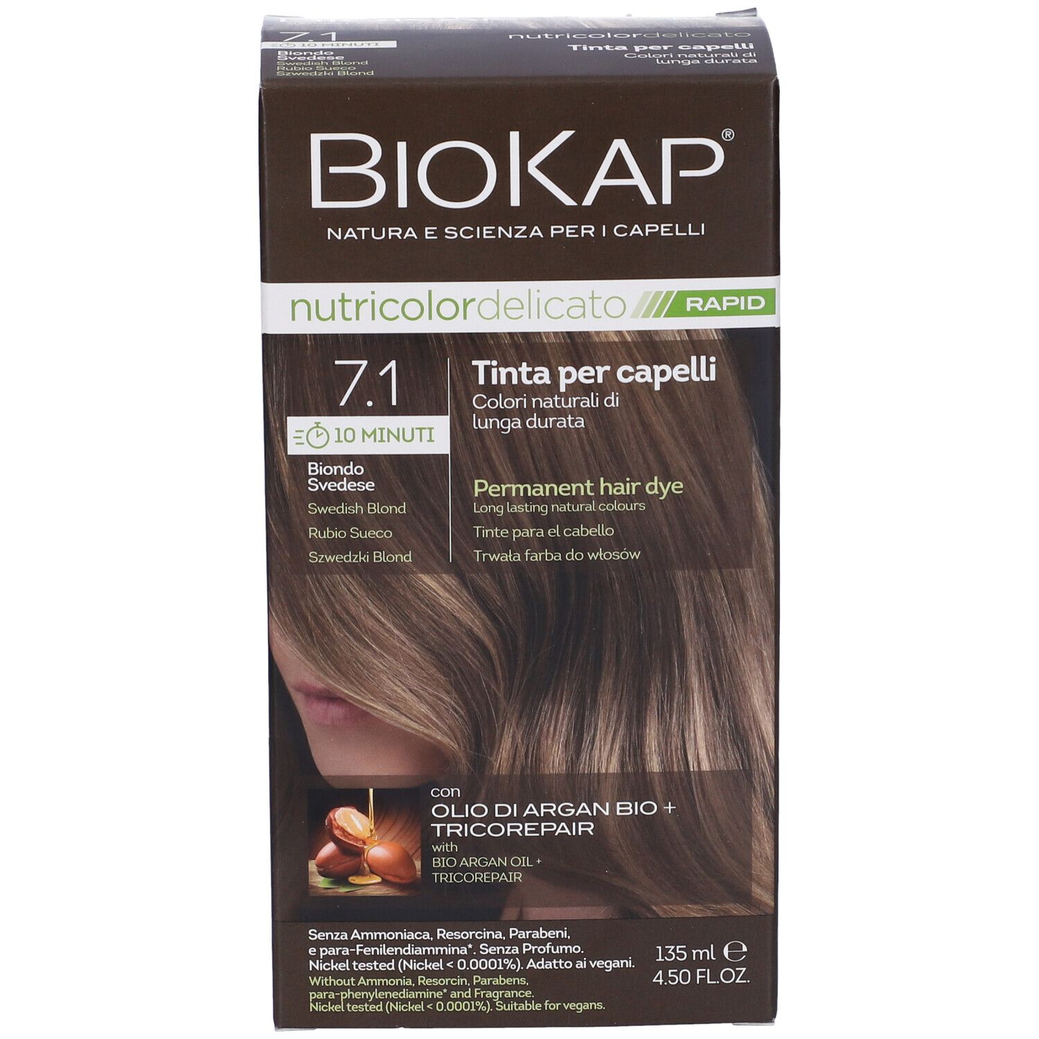 Scatola di tintura per capelli. Scritta: Biokap Nutricolor Delicato Rapid 7,1. Immagine di capelli. Con olio di Argan e Tricorepair.