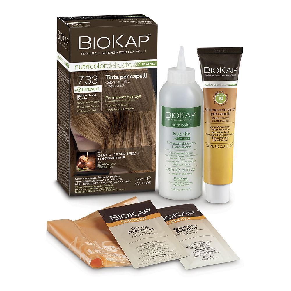Set per la colorazione dei capelli. Contiene una scatola, un flacone, un tubetto e bustine. Sulla scatola è scritto "Biokap Nutricolor Delicato Rapid 7,33".