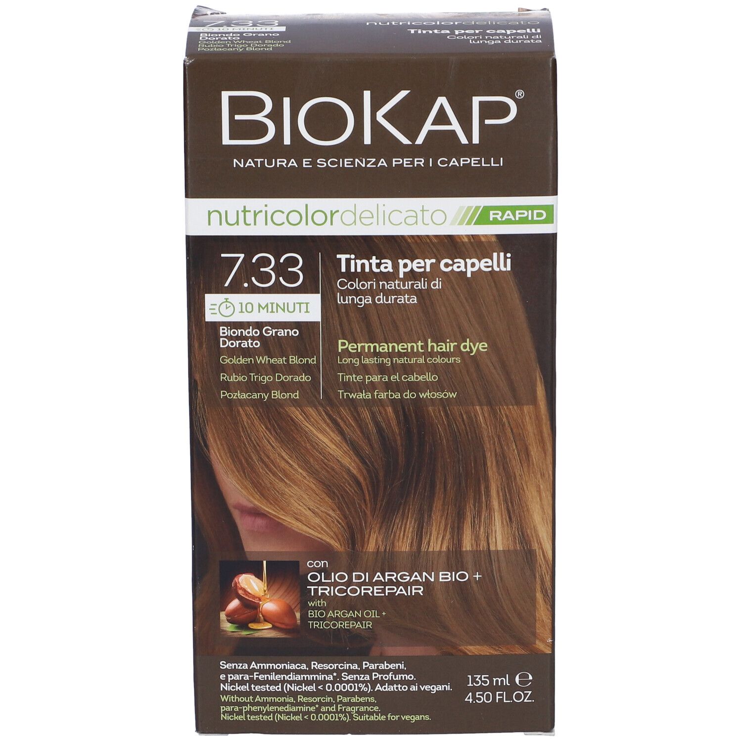 Scatola marrone con "Biokap Nutricolor Delicato Rapid 7.33". Scritto: "Tinta per capelli". Immagine di colore per capelli.