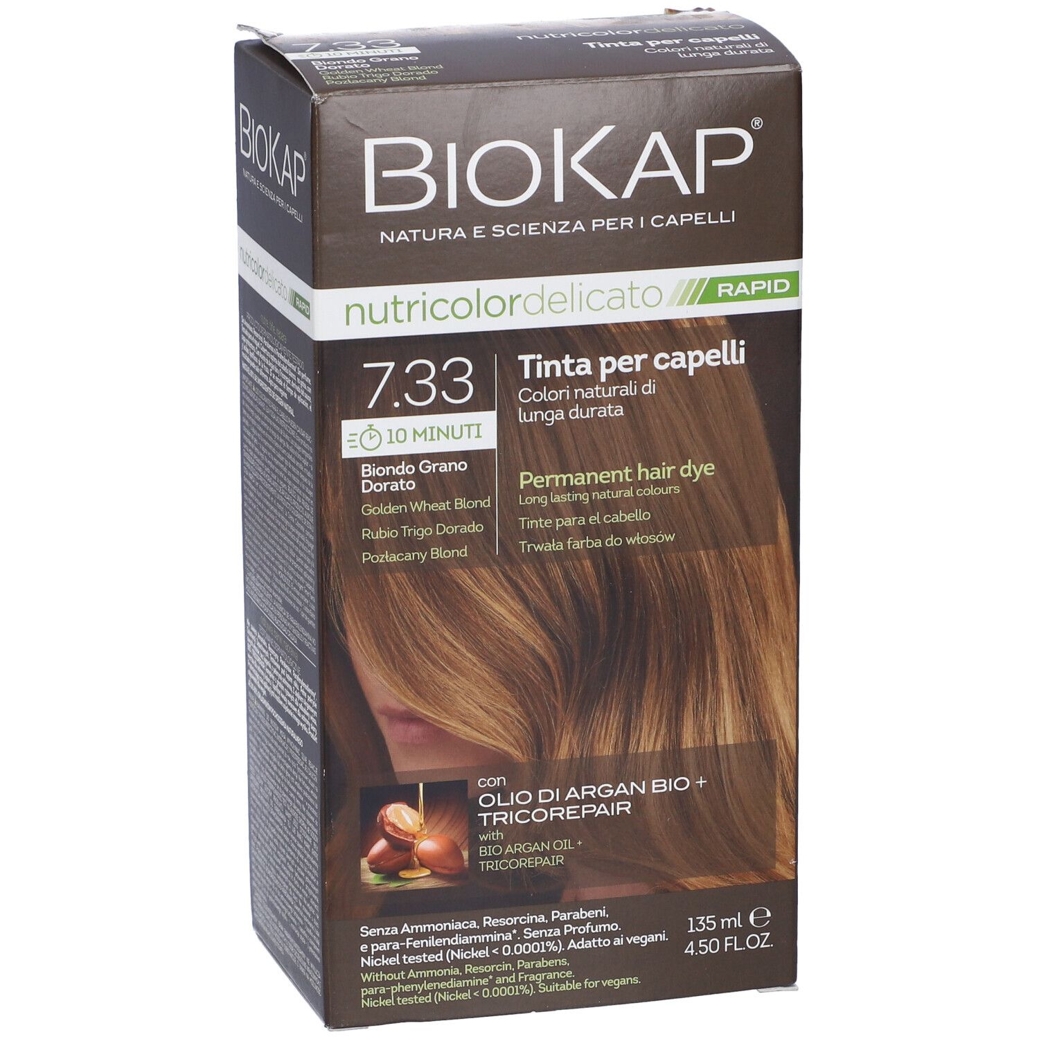 Scatola marrone con "Biokap Nutricolor Delicato Rapid 7.33". Scritto: "Tinta per capelli". Immagine di colore per capelli.
