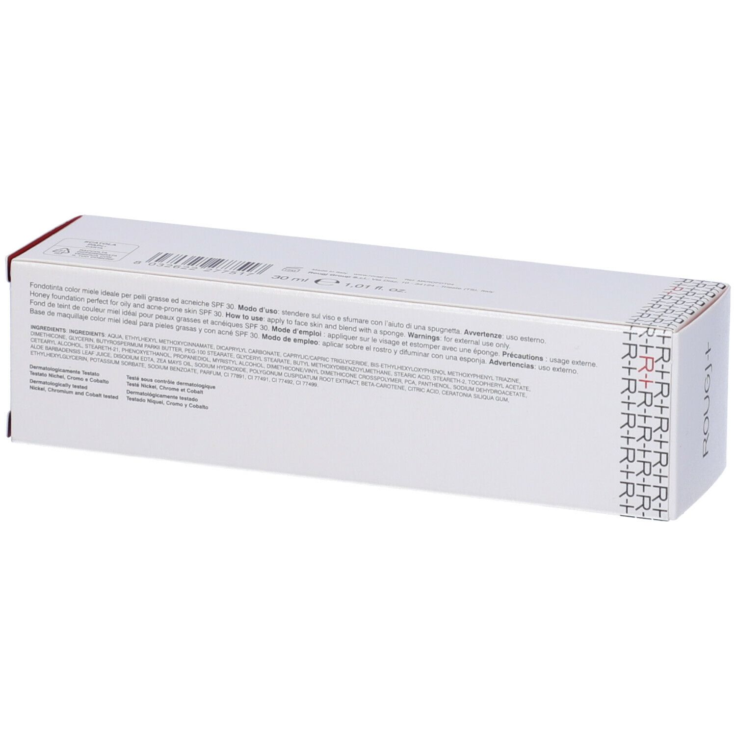 Scatola bianca, retro con testo. Nome prodotto ROUGJ+. Testo: Fondotinta Antiacne Antisebo SPF 30 Miele. Ingredienti.
