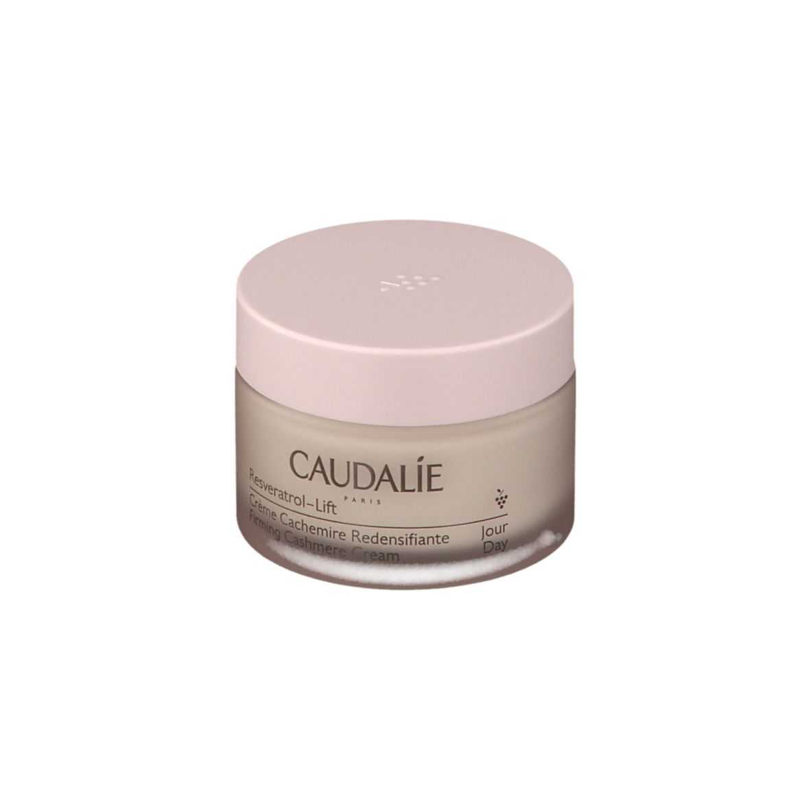 Pot de crème avec couvercle rose. Inscription: CAUDALIE, Resveratrol-Lift, Crème Cachemire Redensifiante.