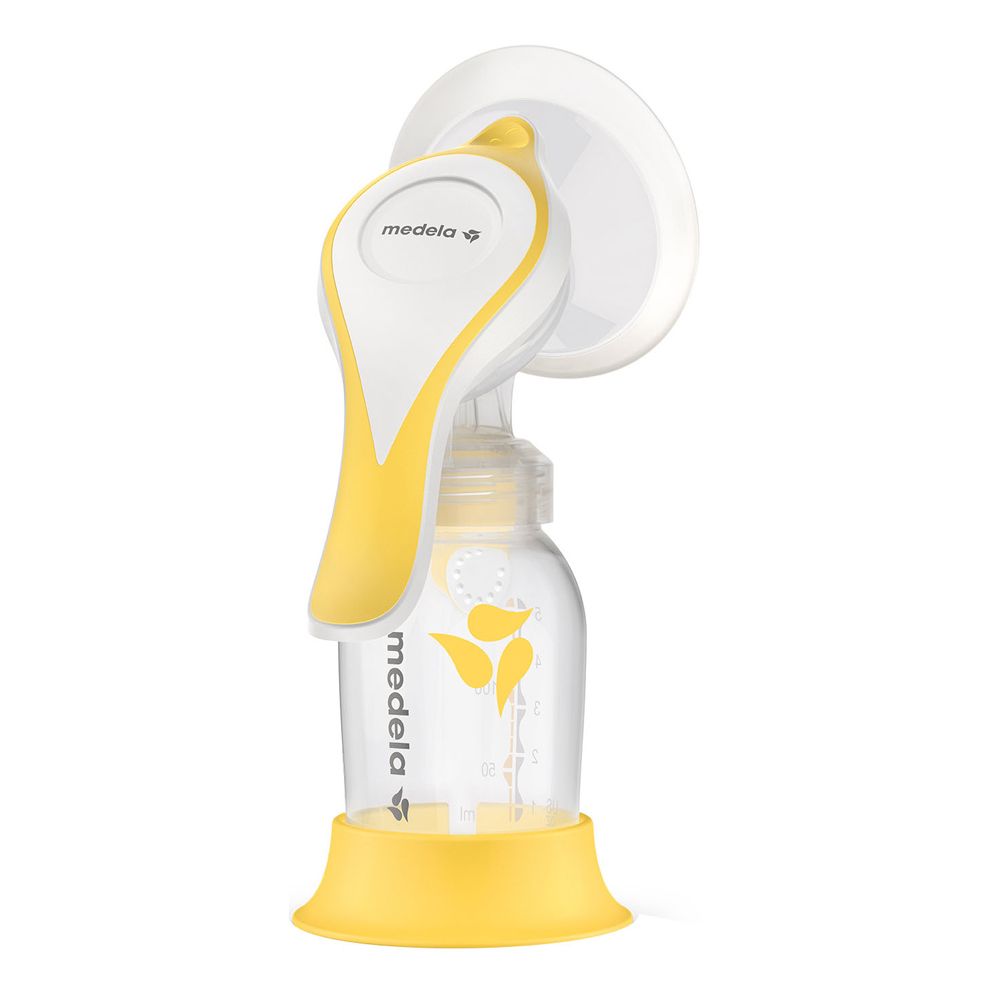 Tiralatte manuale giallo e bianco. Composto da bottiglia, imbuto, manico e base. Marchio Medela.