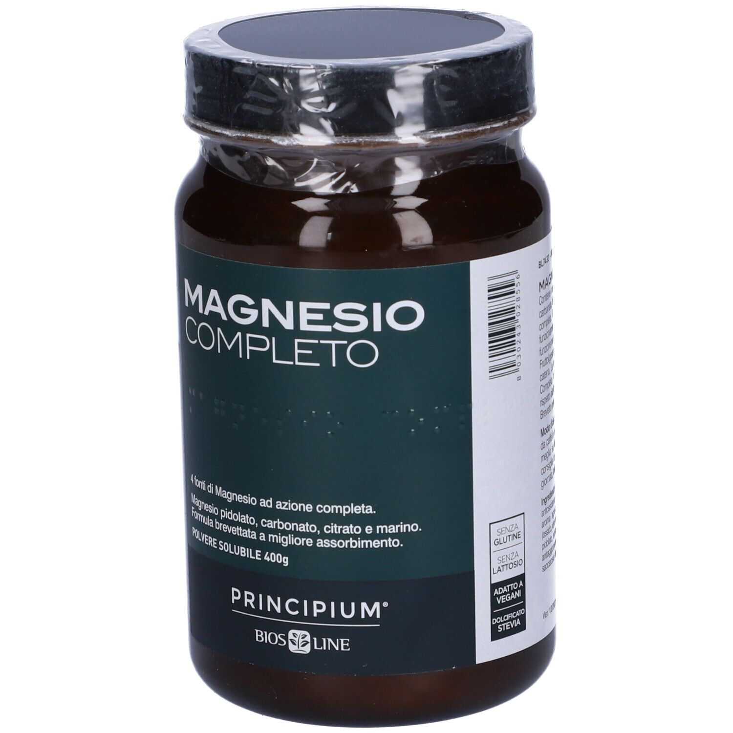 Barattolo di vetro marrone con coperchio. Scritta: Magnesio Completo. Marchio: Principium, Bios Line. Polvere, 400g. Vegano.