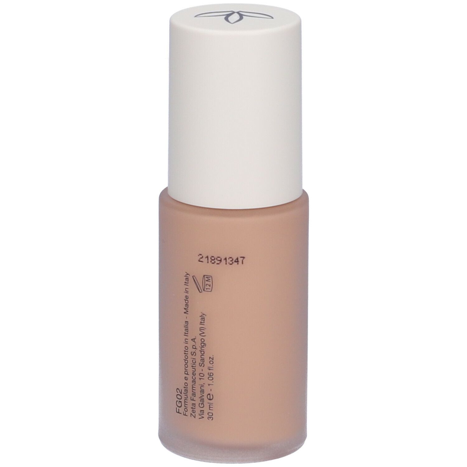 Fondotinta fluido beige in flacone con tappo bianco. Scritta e informazioni di produzione.