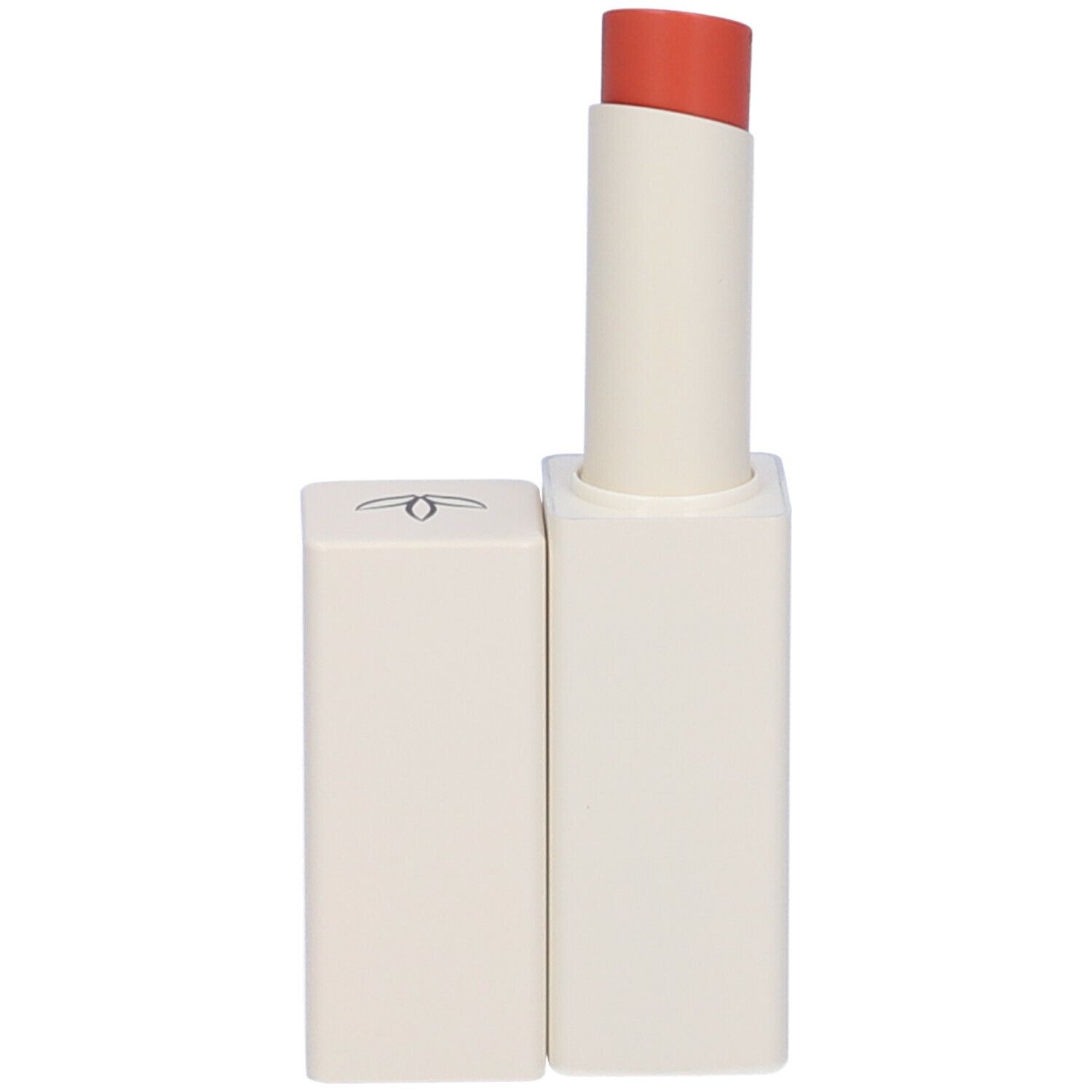 Balsamo labbra con cappuccio aperto. Contenitore bianco con rossetto arancione. Marchio Euphidra.