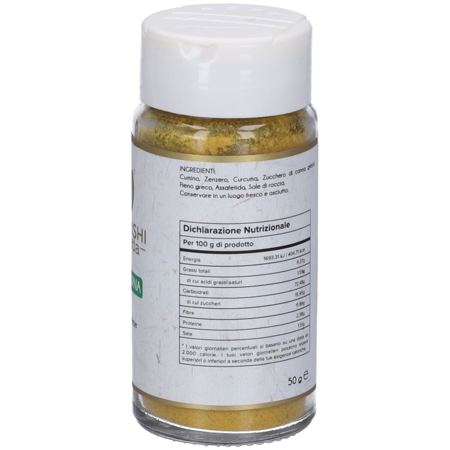 Glasbehälter mit gelbem Inhalt. Aufschrift: Maharishi Ayurveda, Vata Churna, Miscela di spezie, 50 g. Nährwertdeklaration.