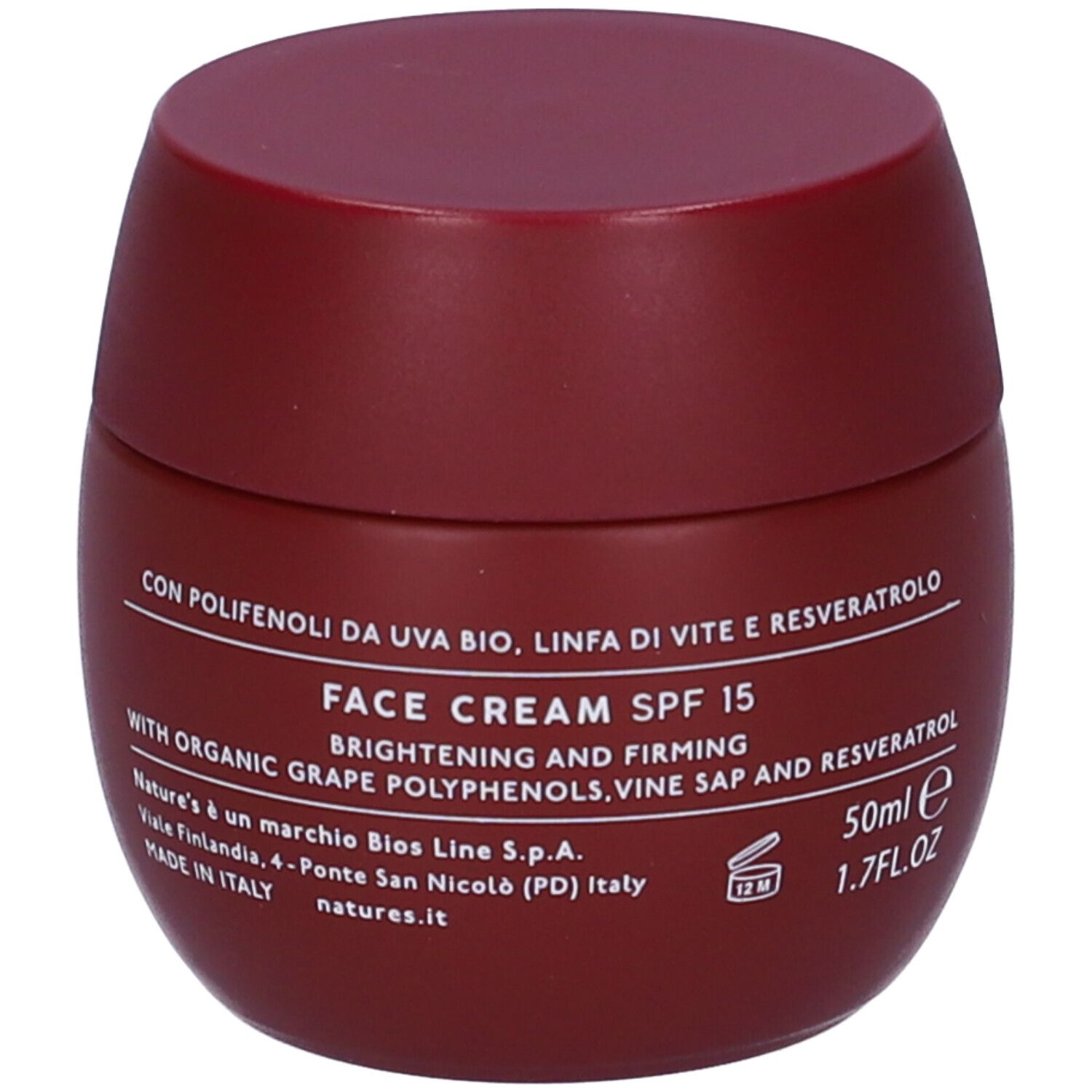 Vaso di crema bordeaux con coperchio. Scritta: FACE CREAM SPF 15. Testo con ingredienti e informazioni del produttore.