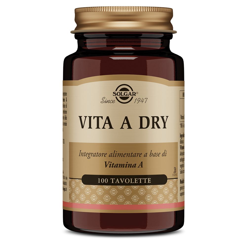 Flacone di vetro marrone con tappo dorato. Scritta: SOLGAR Vita A Dry, 100 compresse. Compresse marroni visibili.