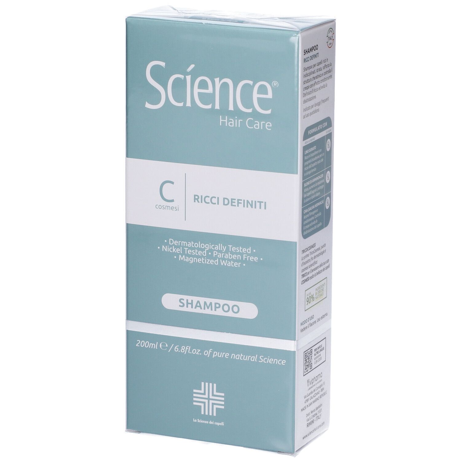 Confezione del prodotto. Scatola verde e bianca con immagine del flacone di shampoo. Scritta: Science Hair Care, Ricci Definiti, Shampoo. Dermatologicamente testato.
