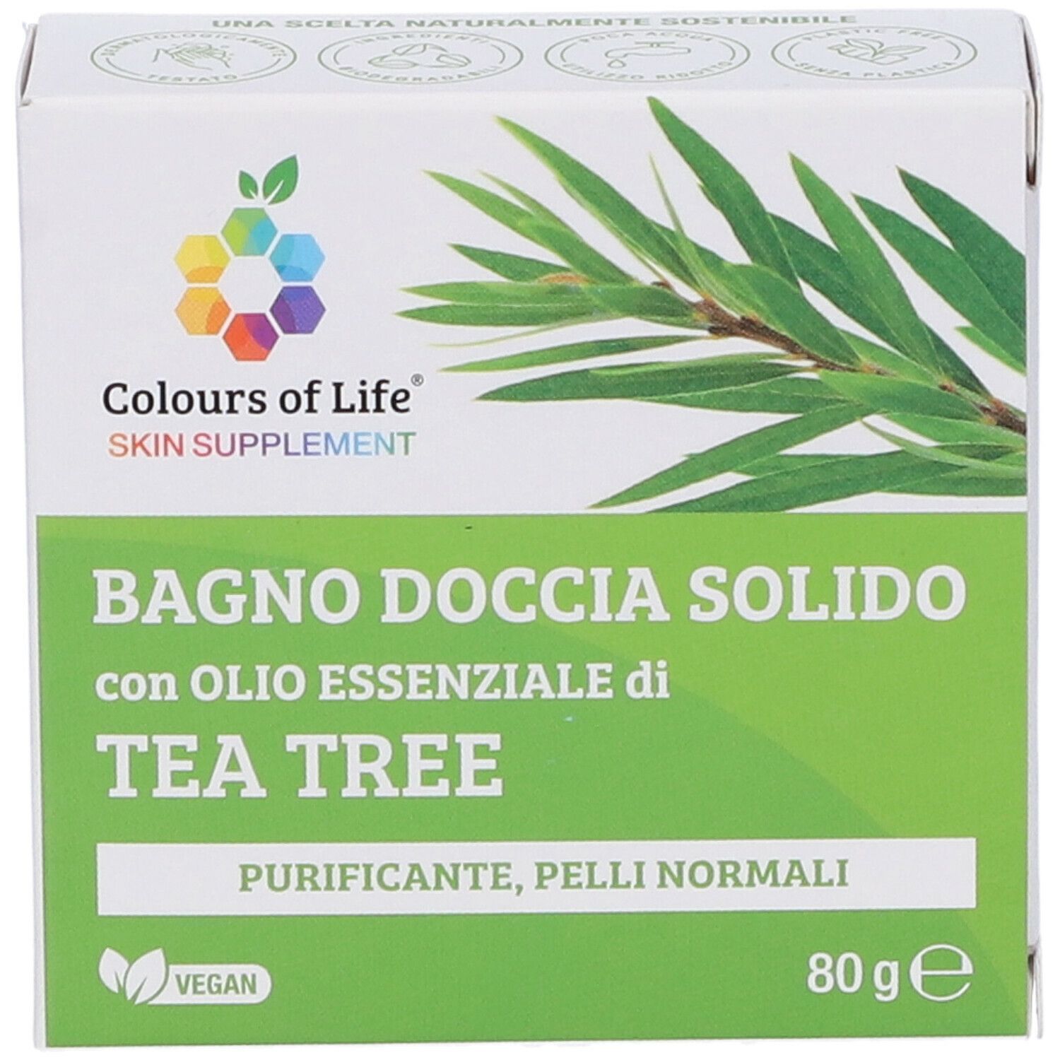 Scatola con stampa del prodotto. Colours of Life Skin Supplement. Testo: Bagno Doccia Solido con olio di Tea Tree. 80g. Vegano.
