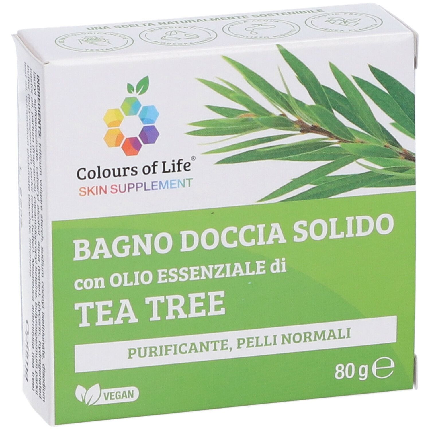 Scatola con stampa del prodotto. Colours of Life Skin Supplement. Testo: Bagno Doccia Solido con olio di Tea Tree. 80g. Vegano.