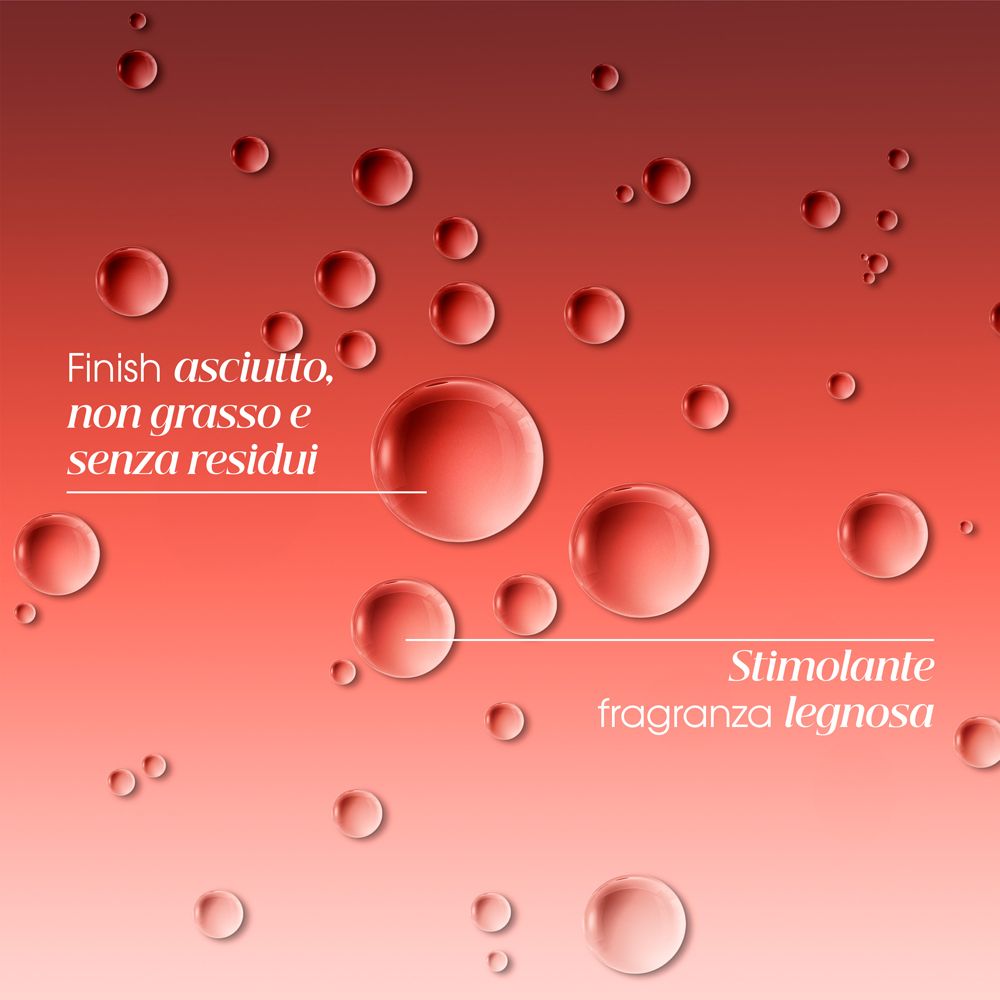 Rote Flüssigkeitstropfen auf rotem Hintergrund. Text: "Finish ascuito, non grasso e senza residui" und "Stimolante fragranza legnosa".