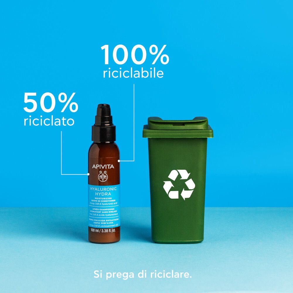 Flacone marrone con erogatore nero. Scritta: Apivita Hyaluronic Hydra. Testo su sfondo blu. Cestino.
