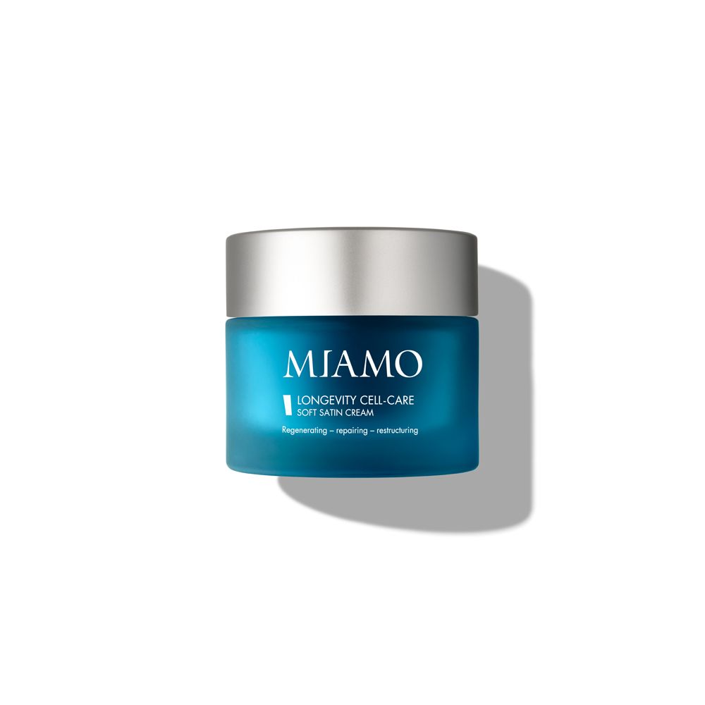 Vaso blu con coperchio argentato. Scritta: MIAMO, Longevity Cell-Care Soft Satin Cream.