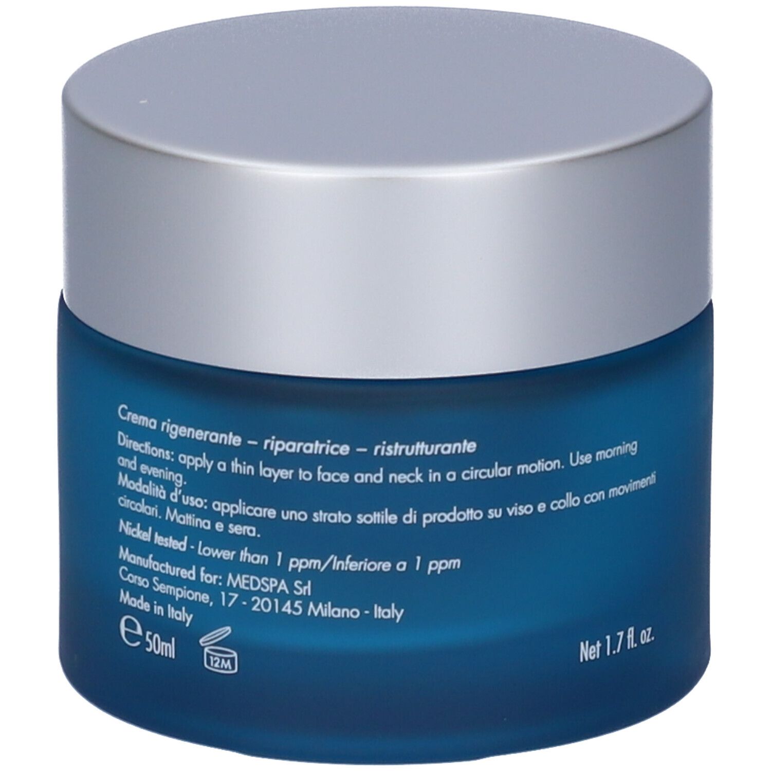 Vaso blu con coperchio argentato. Testo: Creme rigenerante-riparatrice-ristrutturante.