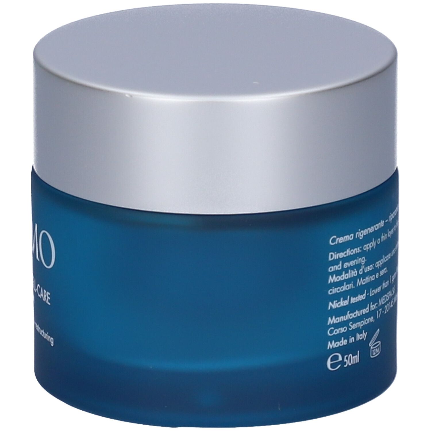 Vaso blu con coperchio argentato. Testo: Creme rigenerante-riparatrice-ristrutturante.