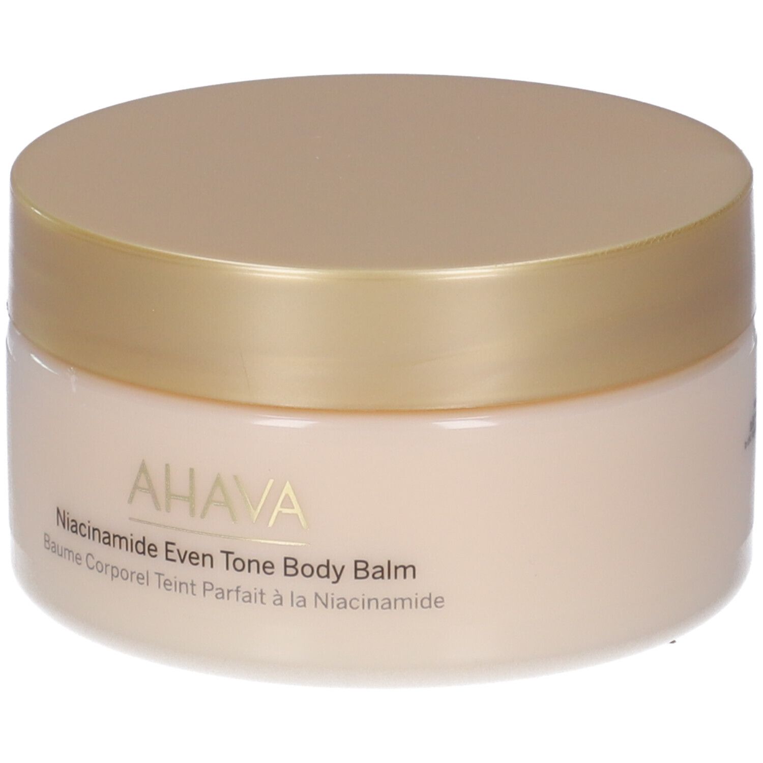 Runder Tiegel mit goldfarbenem Deckel. Aufschrift: AHAVA, Niacinamide Even Tone Body Balm, Baume Corporel Teint Parfait à la Niacinamide.