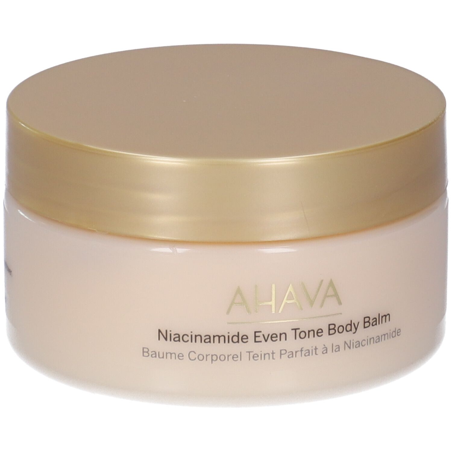 Runder Tiegel mit goldfarbenem Deckel. Aufschrift: AHAVA, Niacinamide Even Tone Body Balm, Baume Corporel Teint Parfait à la Niacinamide.