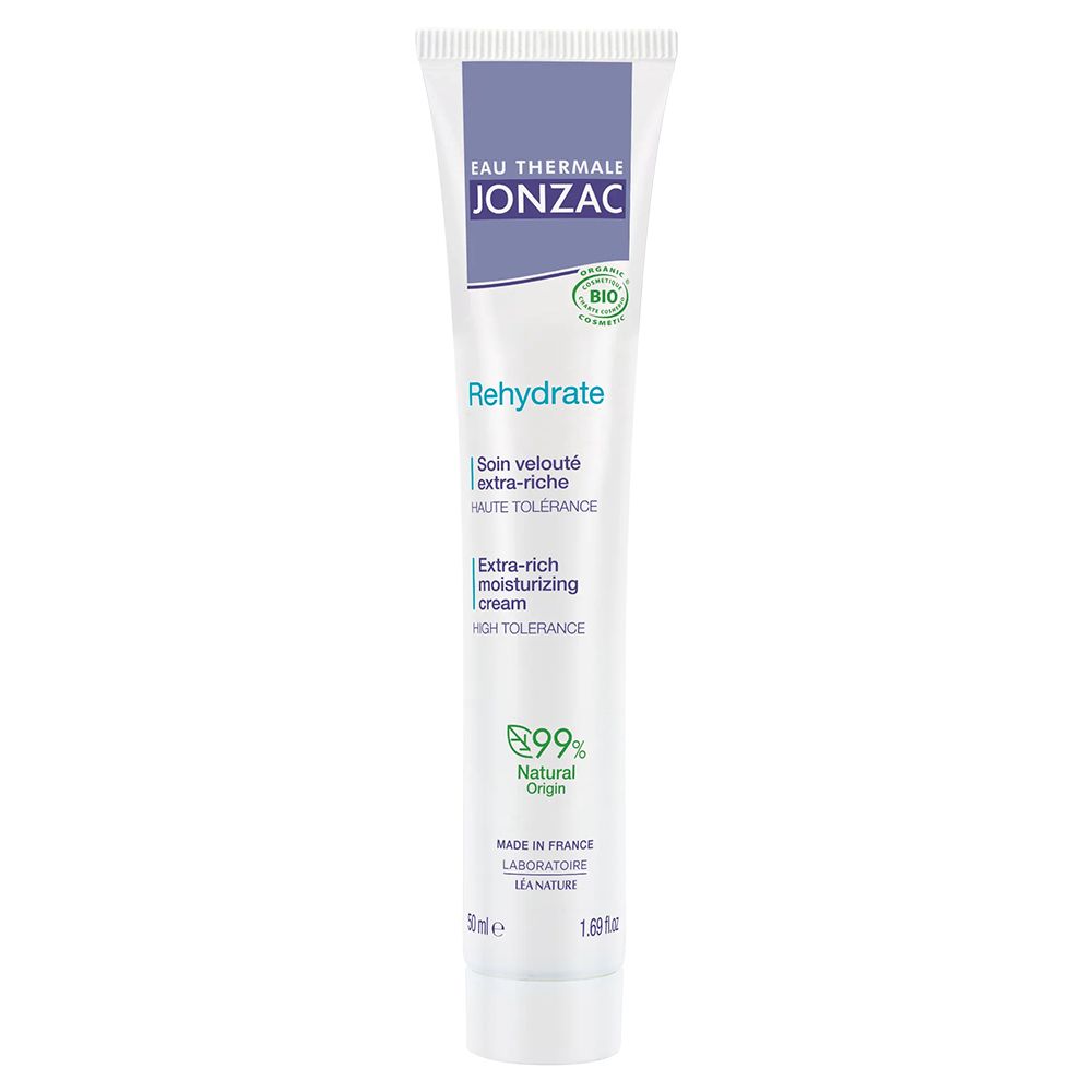 Cremetube. Weiß, lila Akzente. Text: Eau Thermale Jonzac, Rehydrate, Extra-Ricca Idratante. Bio-Zertifizierung.