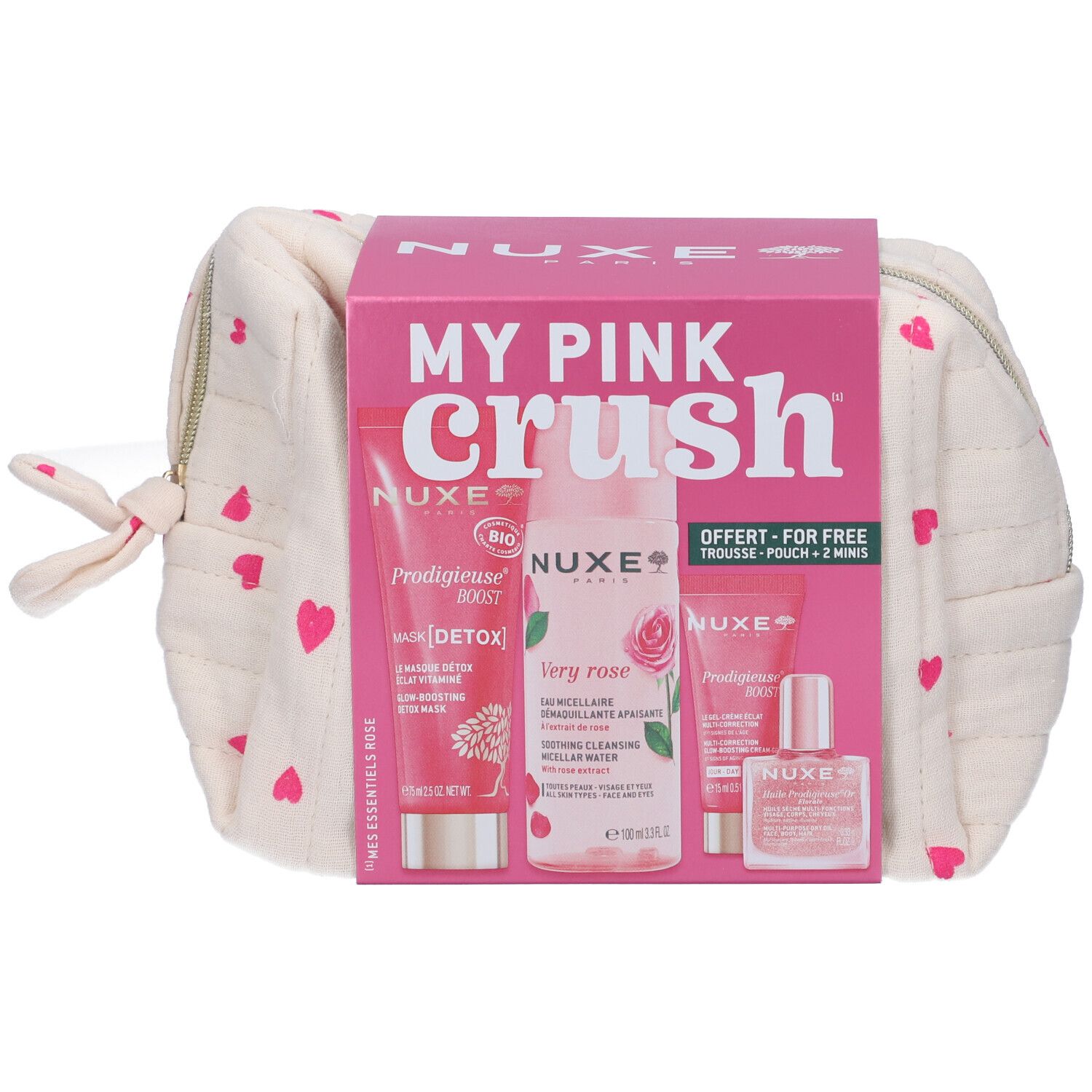 Beauty case crema con cuori rosa e confezione. Contiene diversi prodotti, tra cui un flacone e tubetti.
