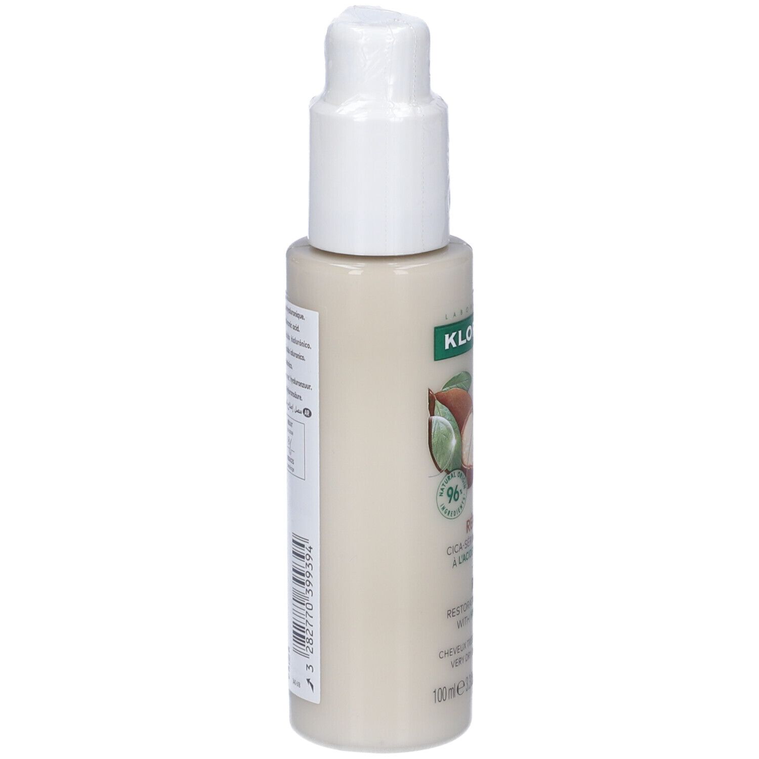 Flacone beige con erogatore bianco. Etichetta laterale con testo e codice a barre. Logo Klorane.