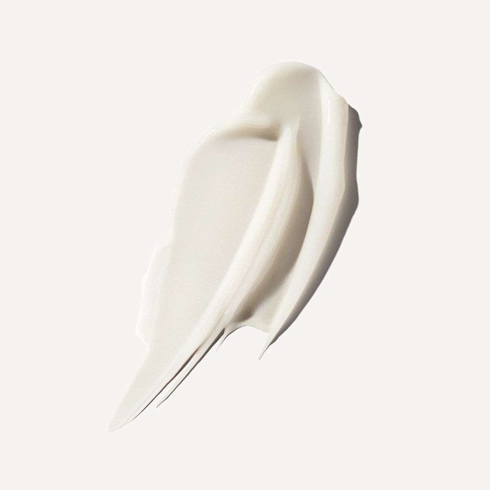 Eine weiße Creme-Textur mit glatten, geschwungenen Linien auf hellem Hintergrund.