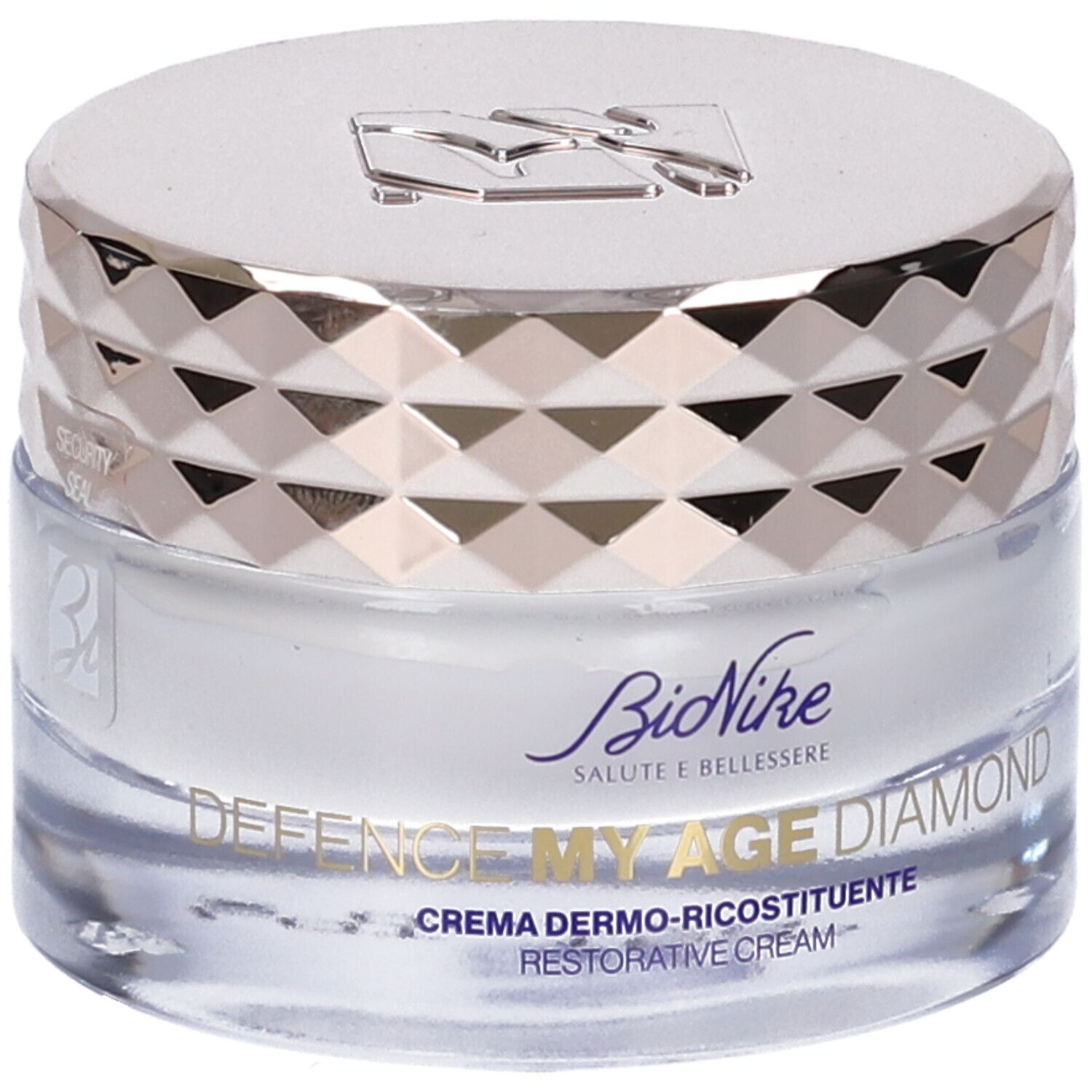 Creme-Tiegel mit silberfarbenem Deckel. Auf dem Tiegel steht "DEFENCE MY AGE DIAMOND" und "CREMA DERMO-RICOSTITUENTE".
