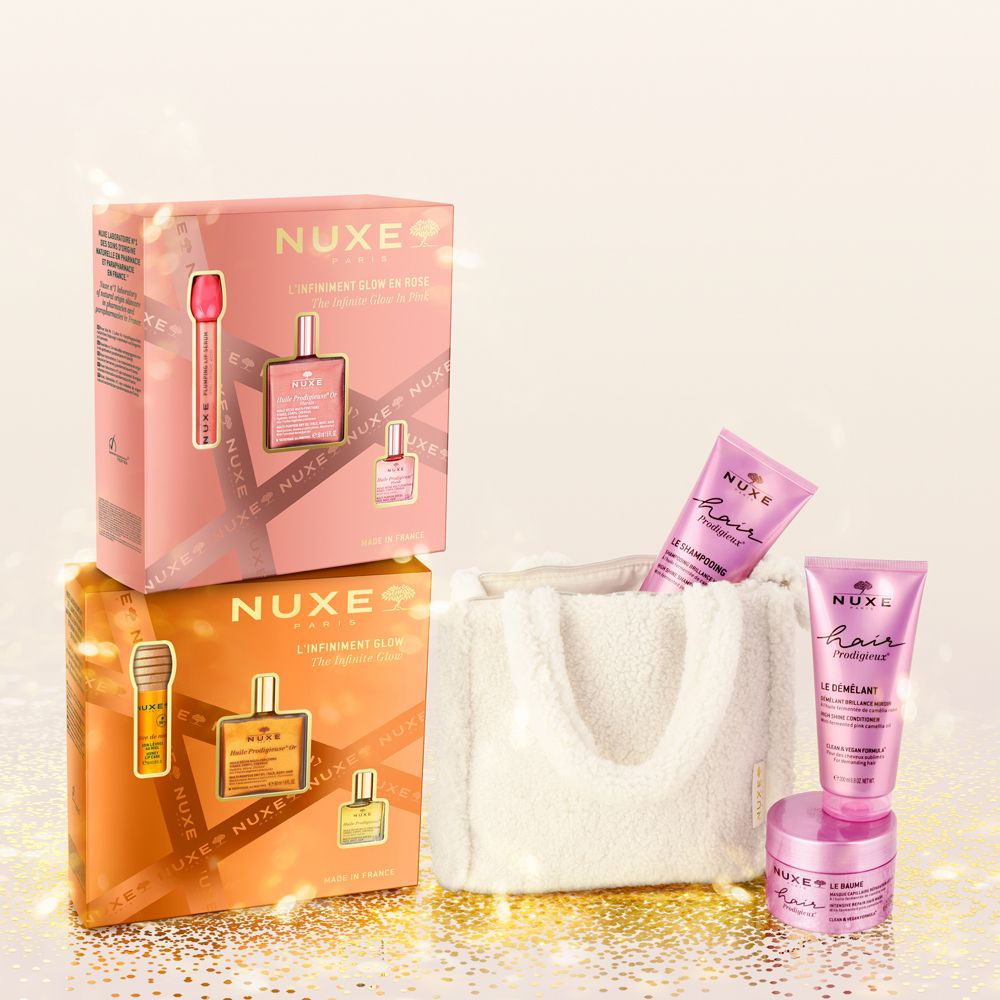Più confezioni regalo con prodotti. Confezioni rosa e arancioni. Contiene siero, olio e creme.