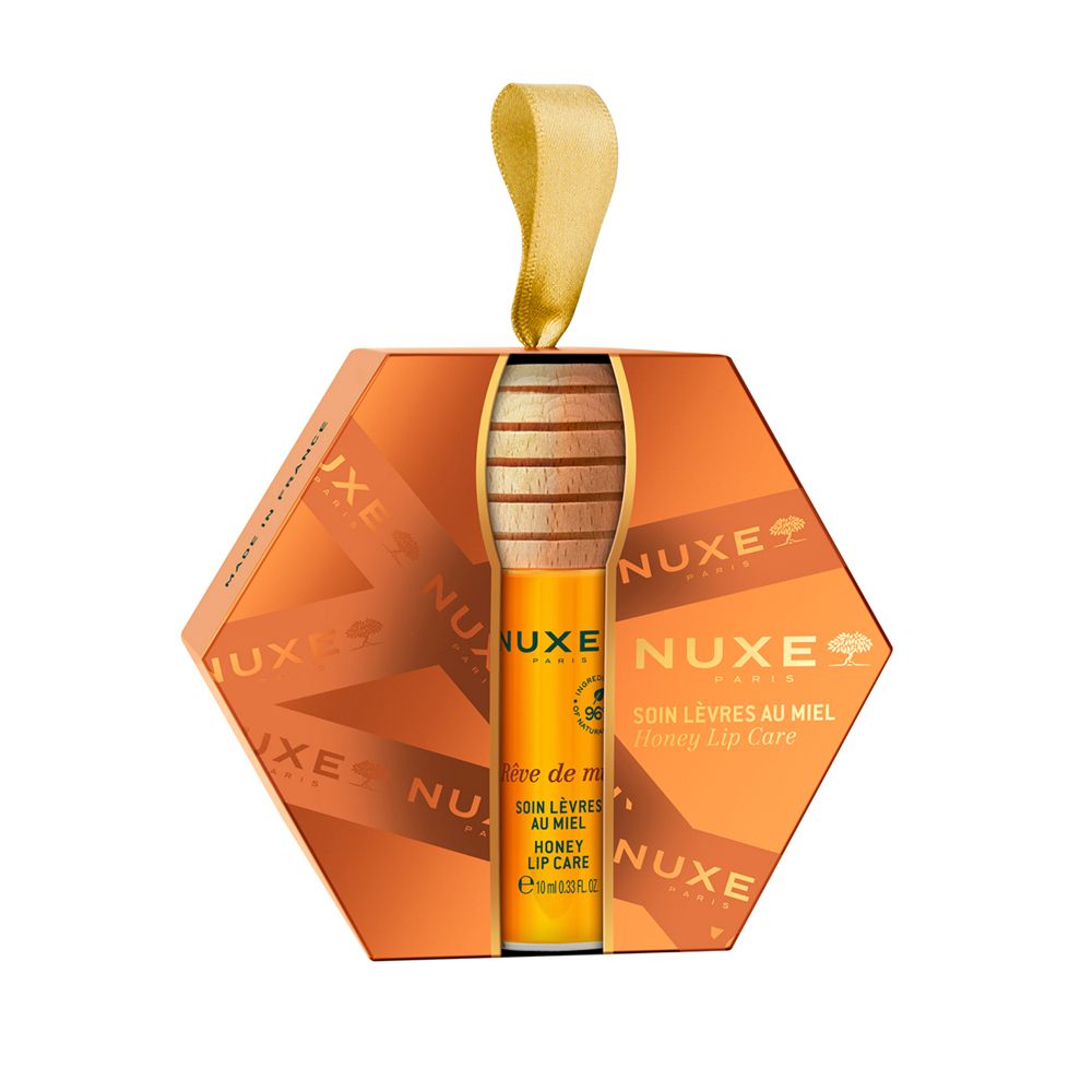 Set Nuxe per la cura delle labbra al miele, confezione a nido d'ape. Include un balsamo labbra e un applicatore in legno.